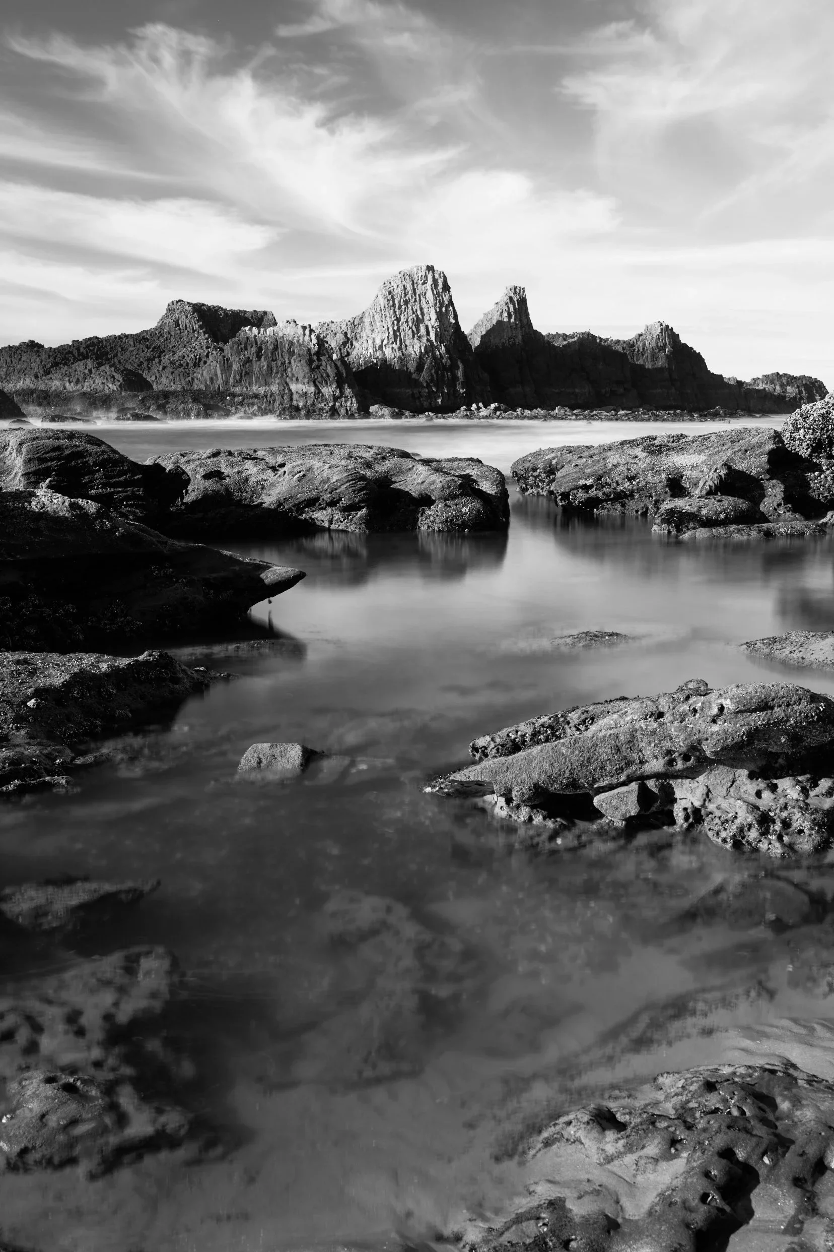 Oregon tide pools stand before seal rocks near Newport Oregon