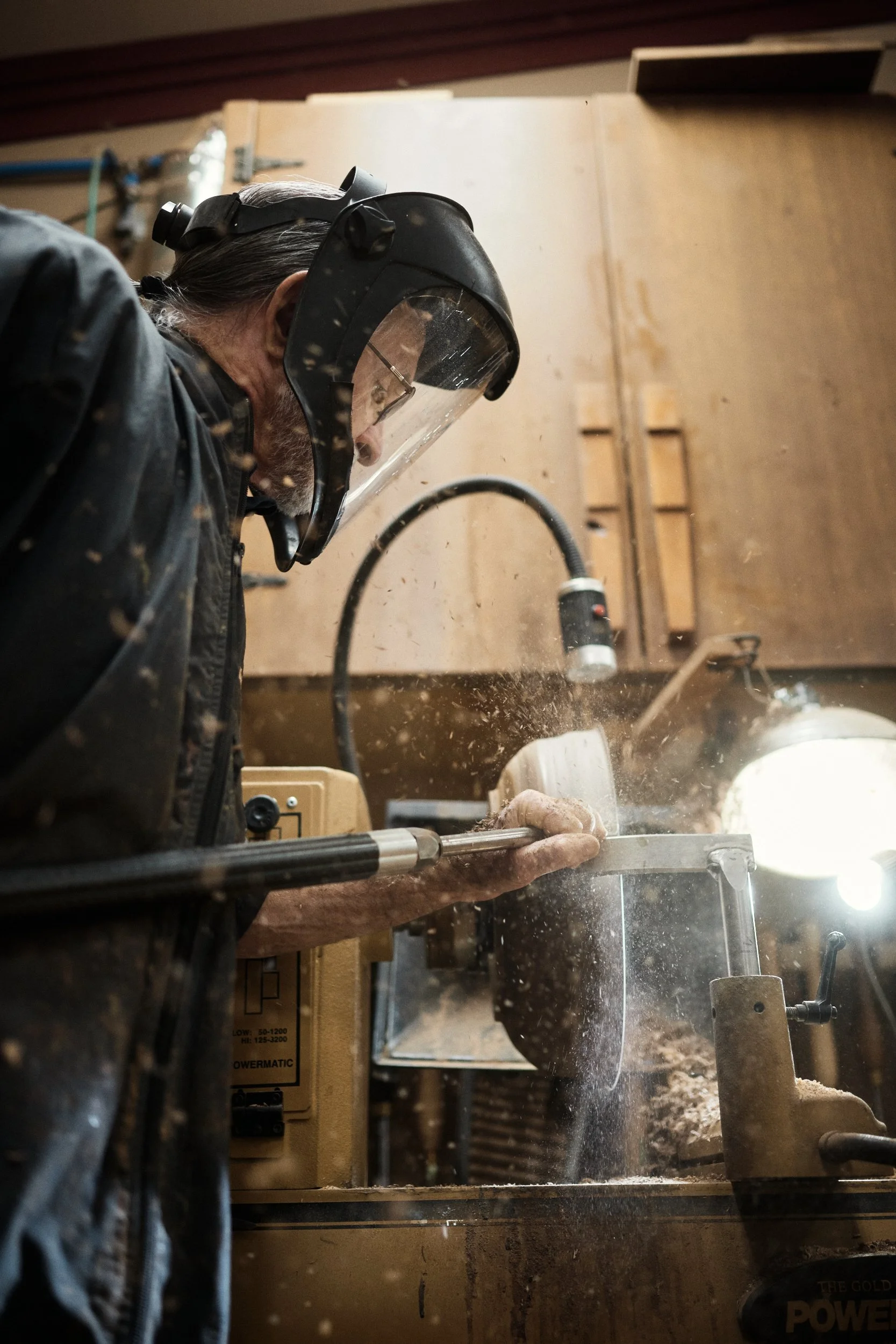 Carpenter Gary Katz turning a wooden bowl in his shop in Oregon.