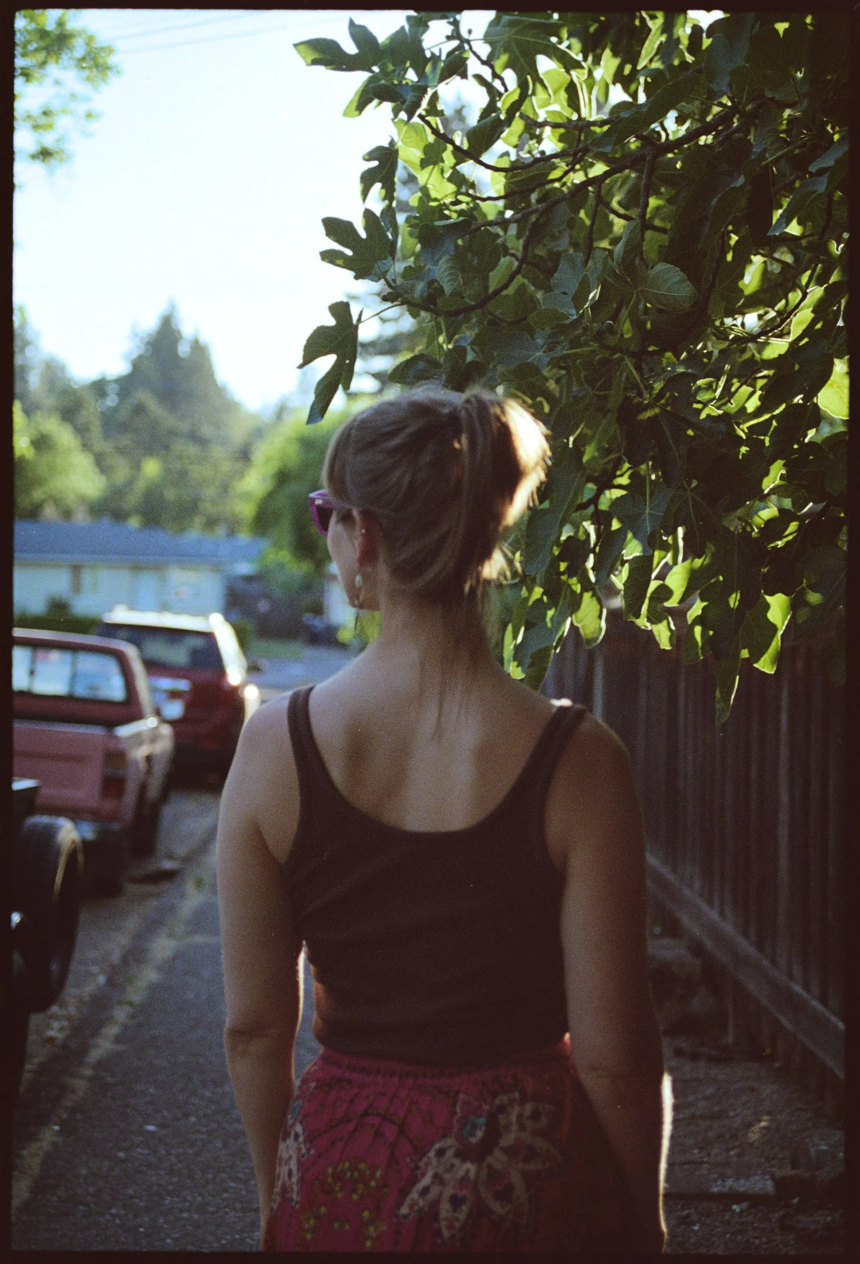 Lady walking down a street in Eugene, Oregon on Portra 400 film.