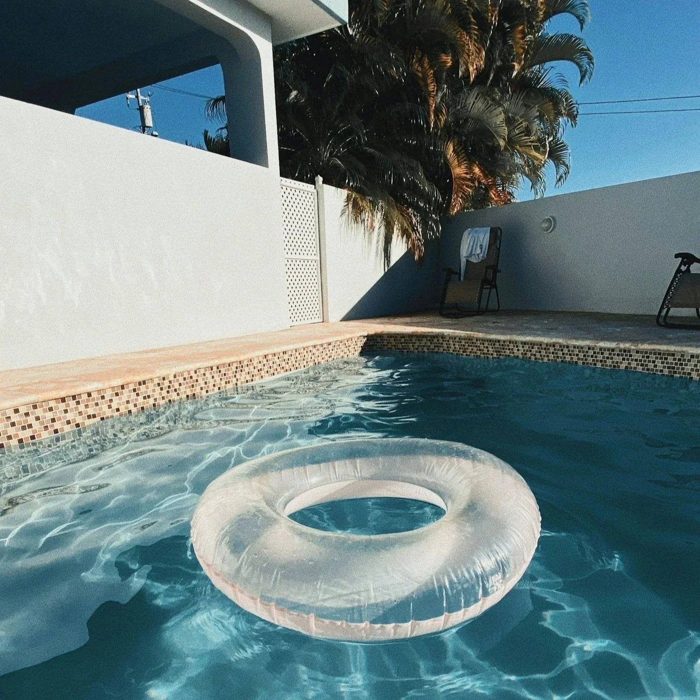 What often starts as a faint chalky line at the waterline can quickly evolve into a thick, crusted band that makes even a well-maintained pool look neglected.