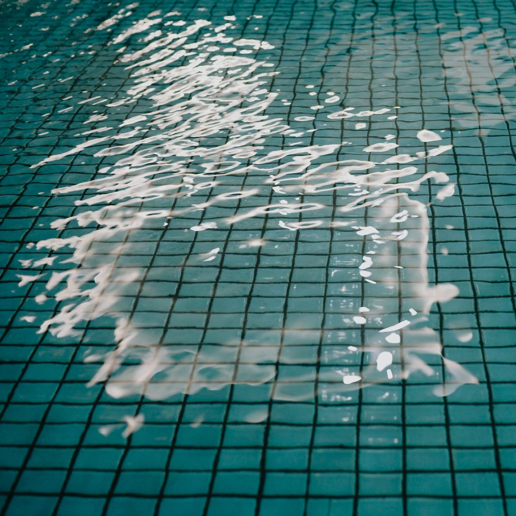 Acid washing is a specialized service designed to restore a pool's visual appeal by removing deeply embedded stains and buildup that standard maintenance cannot address.