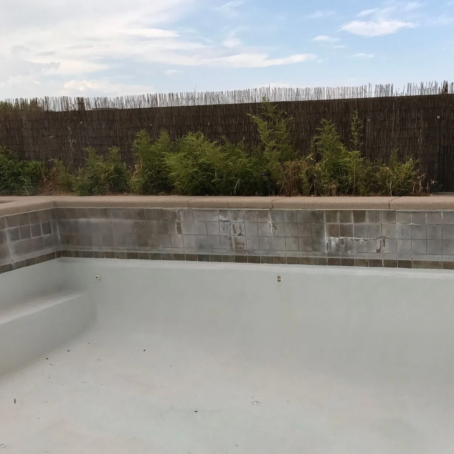 Over time, unsightly white stains and crusty deposits form along the waterline, dulling the appearance of the pool and making the entire outdoor space look less inviting.
