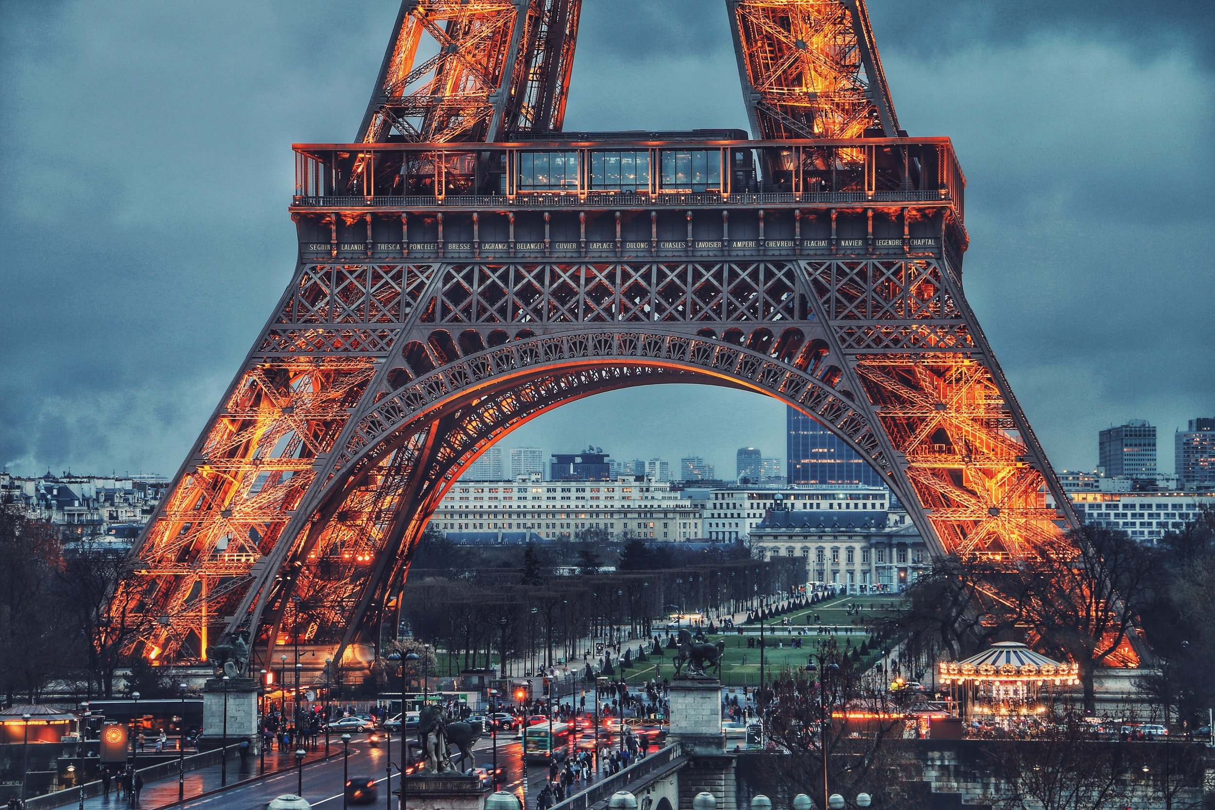 Base of the Eiffel Tower lit up at night