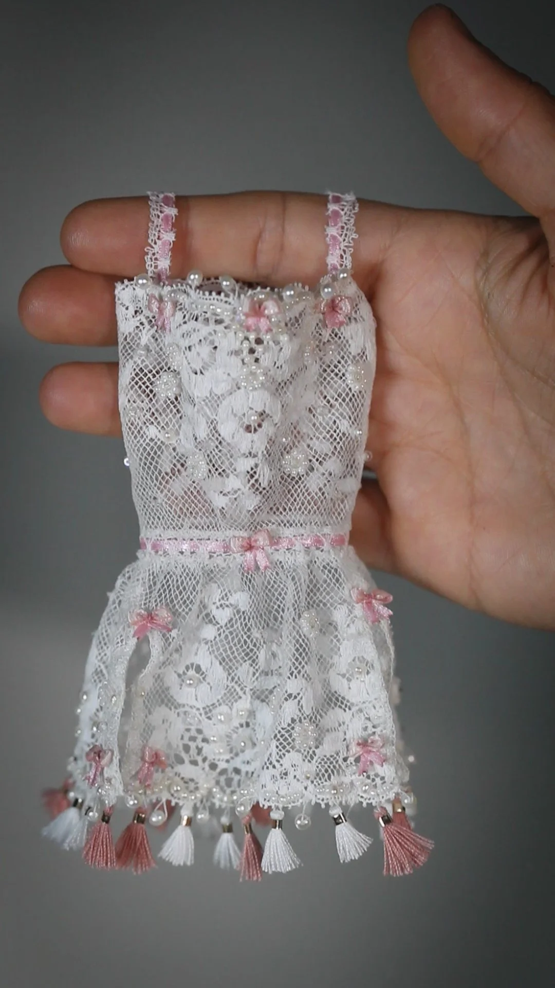 The making of a little lace dress and many micro bows