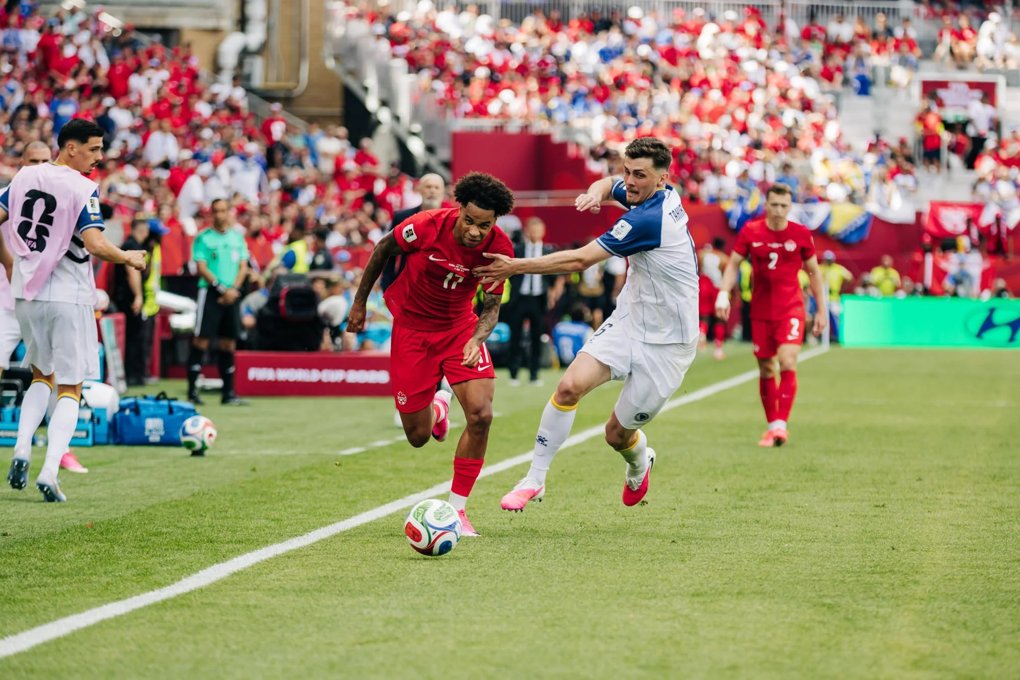 tajon-buchanan-blowing-by-benjamin-tahirović-fifa-world-cup.jpg