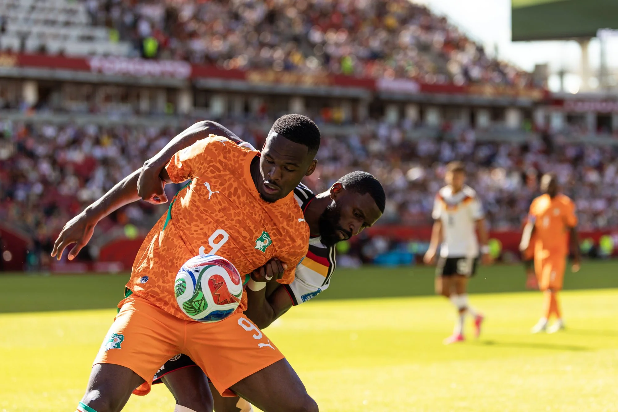 germany-rüdiger-holding-cote-d'ivoire-striker-bonny.jpg