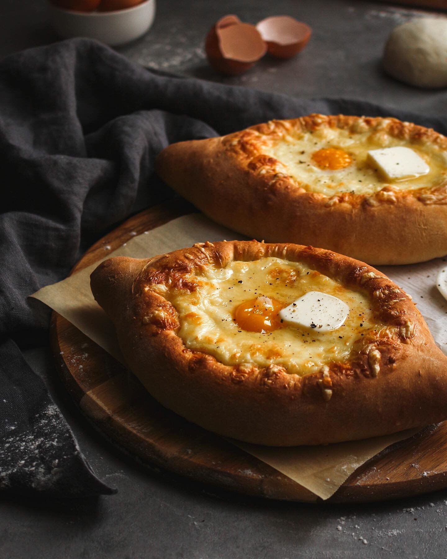 khachapuri~ i made a bunch today! needed lots and lots of cheese... the ones in the pic were a little too big for me, so i made some half sized ones and froze them for later :D

. 
. 
.

#khachapuri #adjariankhachapuri #feta #mozzarella #baking #bake