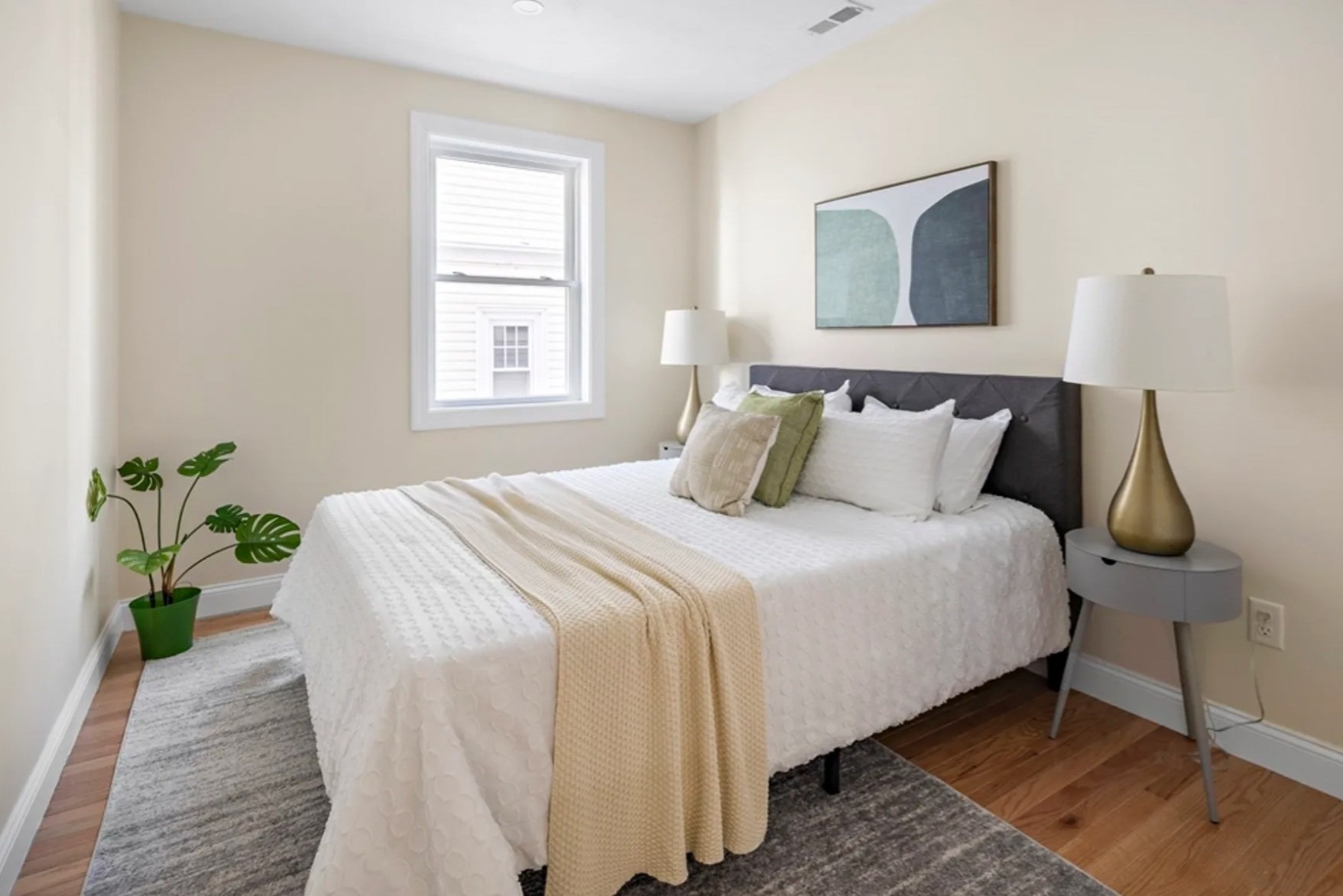 Essentials Second Bedroom with Green Accessories