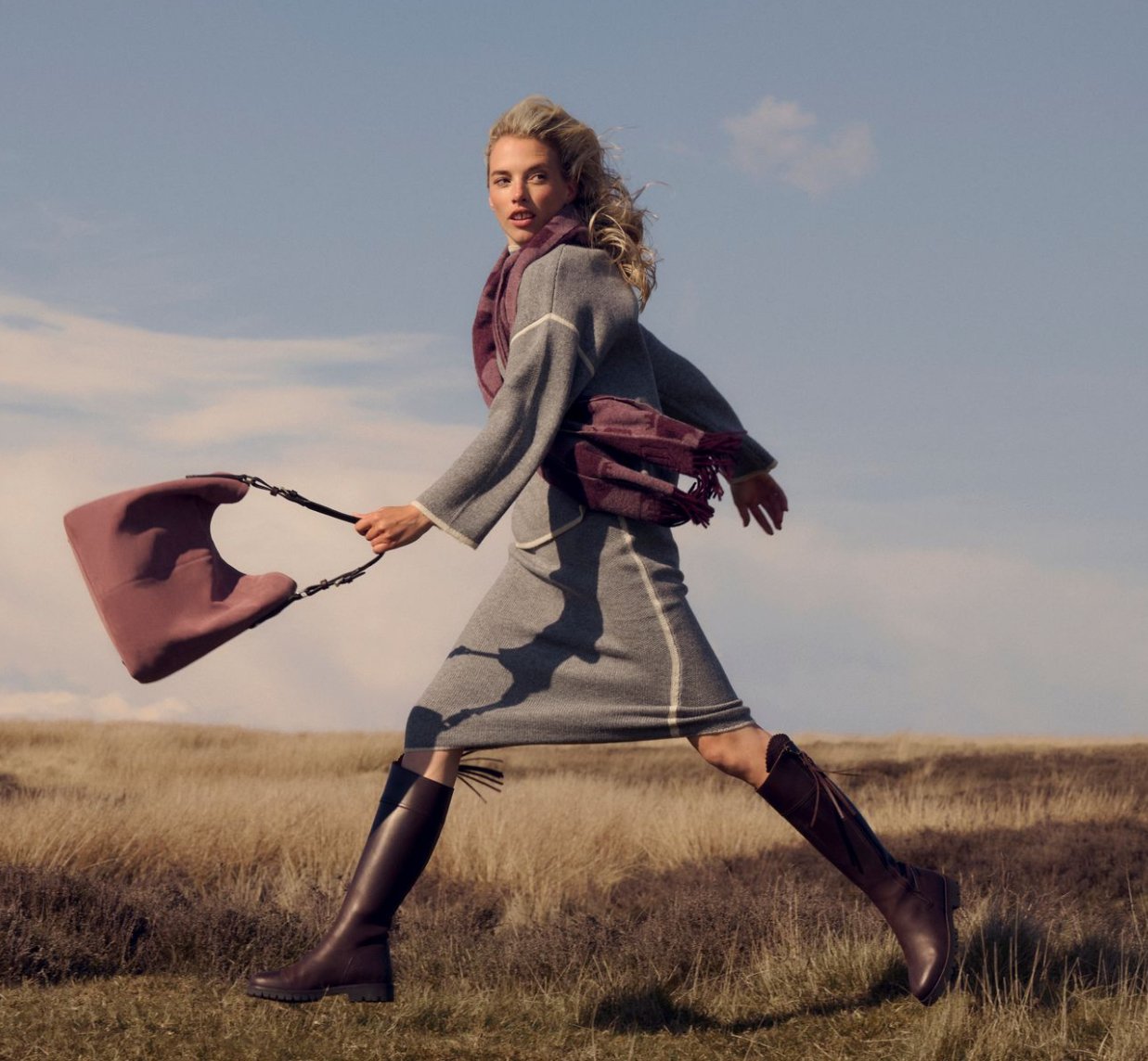 Blonde model, jumping in Scotland. Fashion photoshoot . Natural makeup and hair. Natural makeup artist. Commercial makeup artist. Norfolk makeup artist