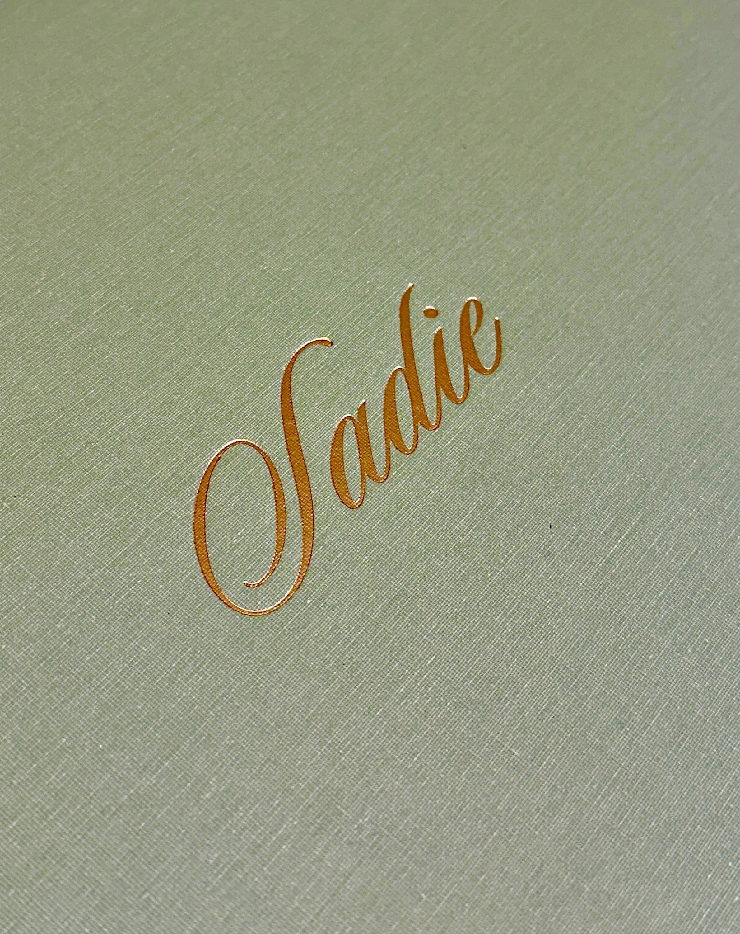 A custom, keepsake box for sweet baby Sadie 🤍

Lined with a whimsical Japanese Chiyogami paper and featuring magnetic lid and silk ribbon closures, this heirloom will become a home for the treasures that will accompany Sadie throughout her life.

Tu