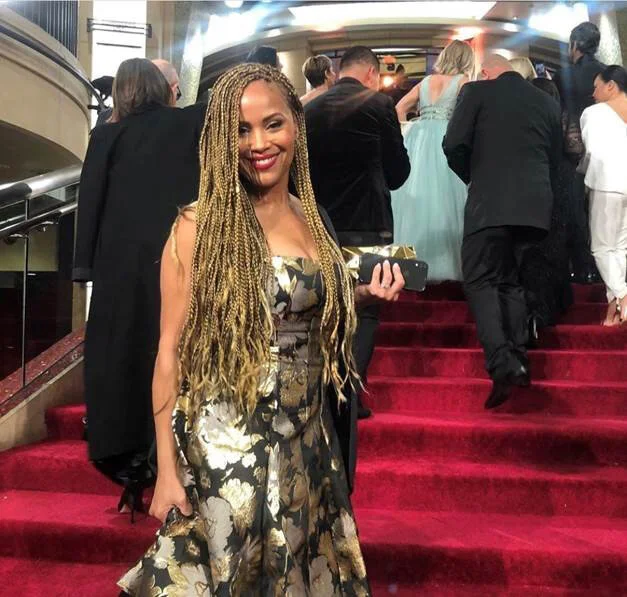 Ayo Davis, ABC VP of Casting in strapless brocade Aidan Mattox ball gown- The Oscars 2020