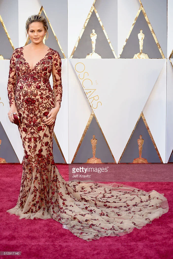 Chrissy Teigen in fully beaded naked  Marchesa gown whilst pregnant- The Oscars 2016