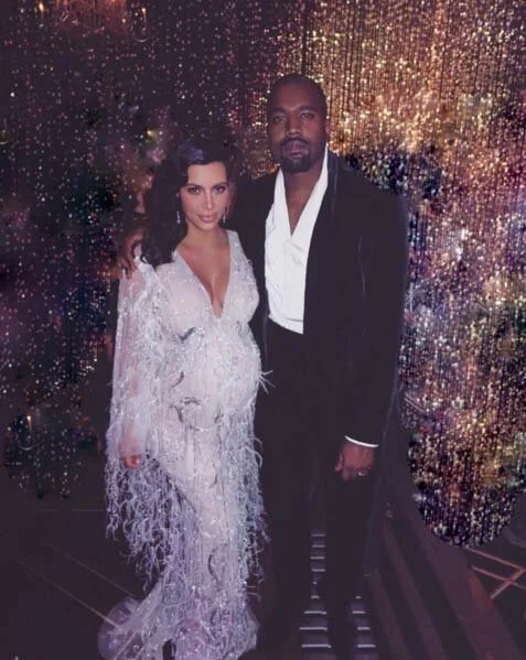 Kim Kardashian in fully beaded shimmy gown with beaded fringe and ostrich feather Marchesa gown for a Gatsby themed party- HelloMagazine.com 2015