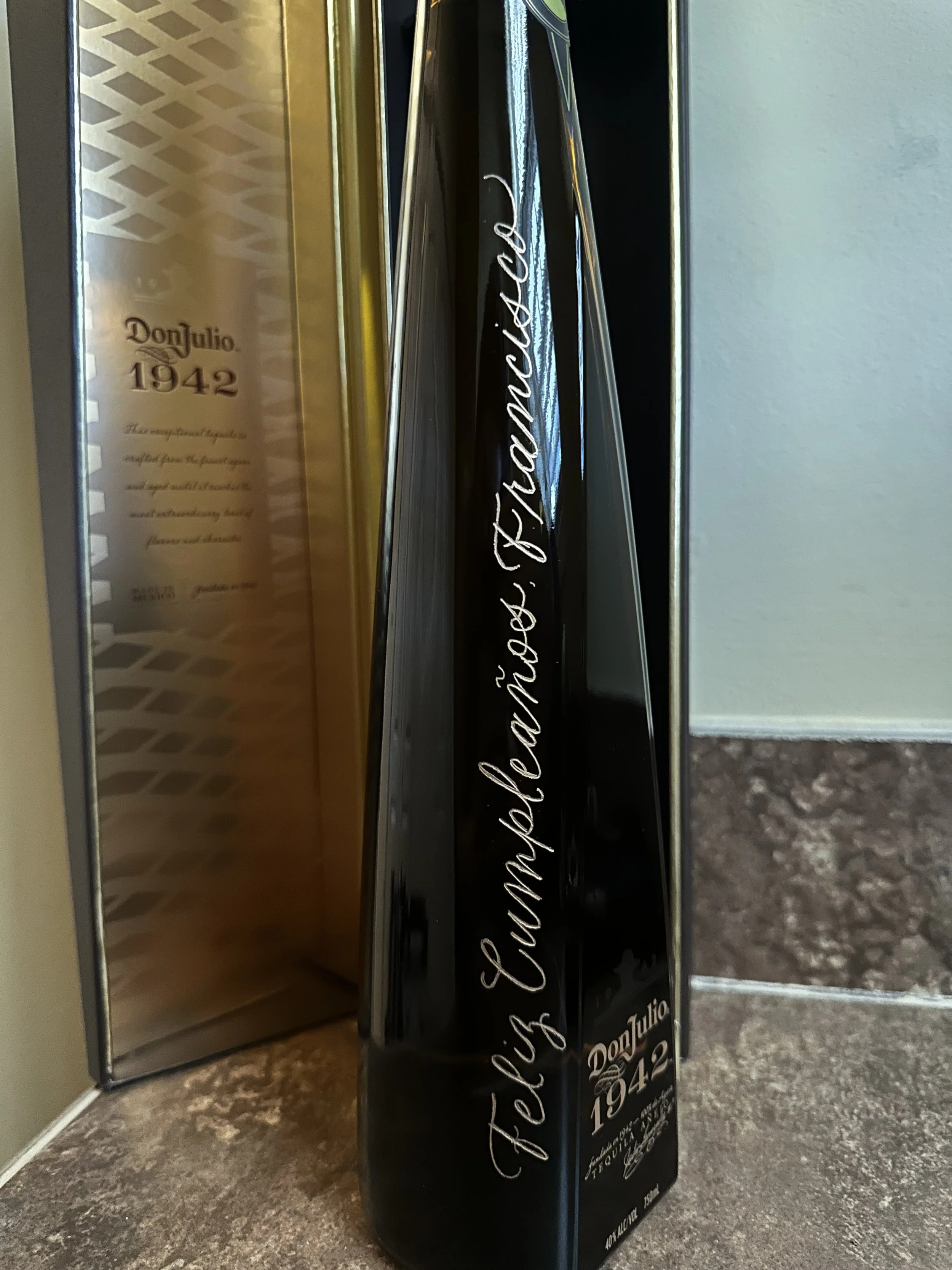 Bottle of don julio 1942. Hand engraved with “feliz cumpleaños Francisco” with a gold fill