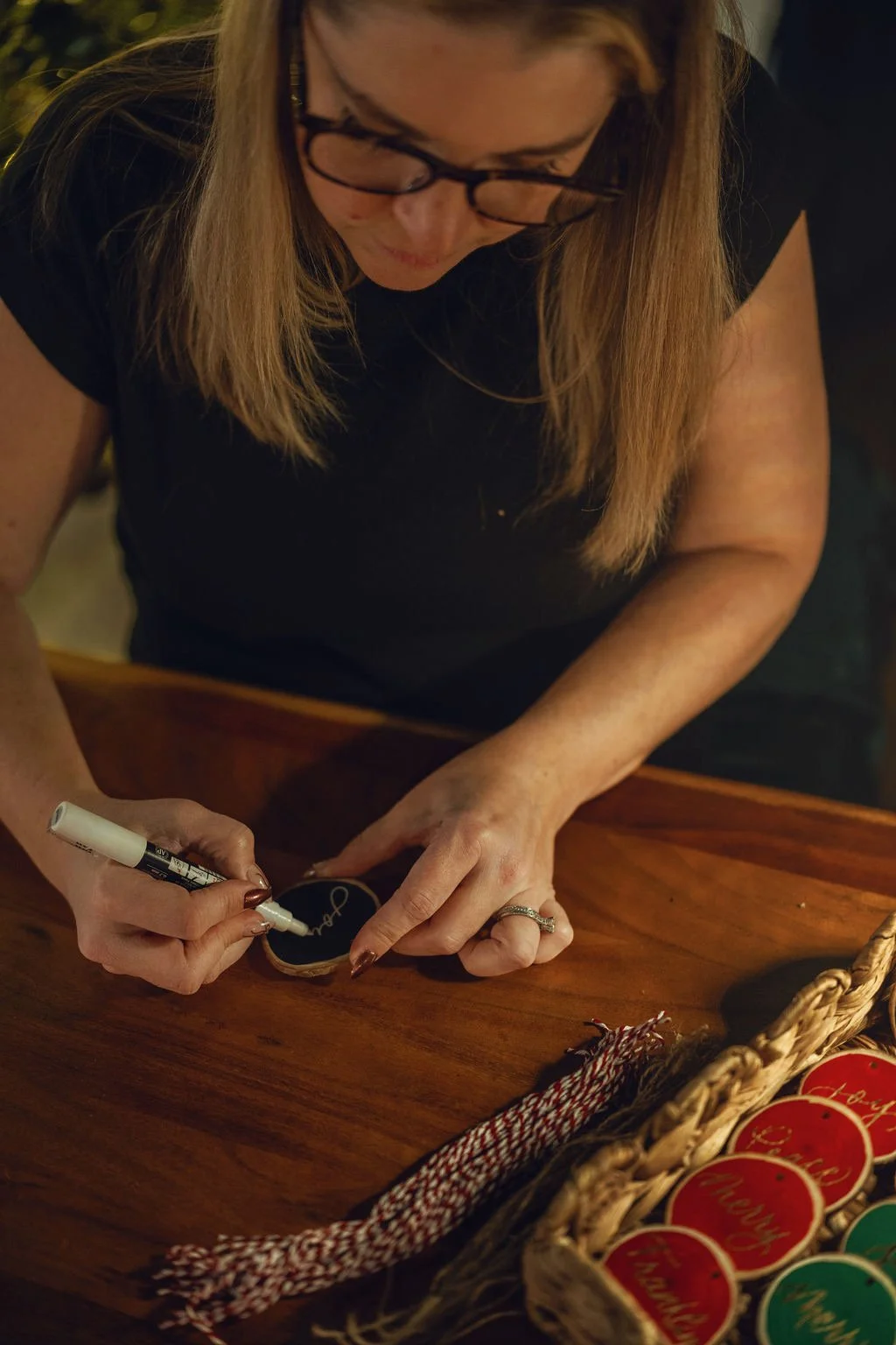 custom calligraphy on ornaments on-site at welcome reception