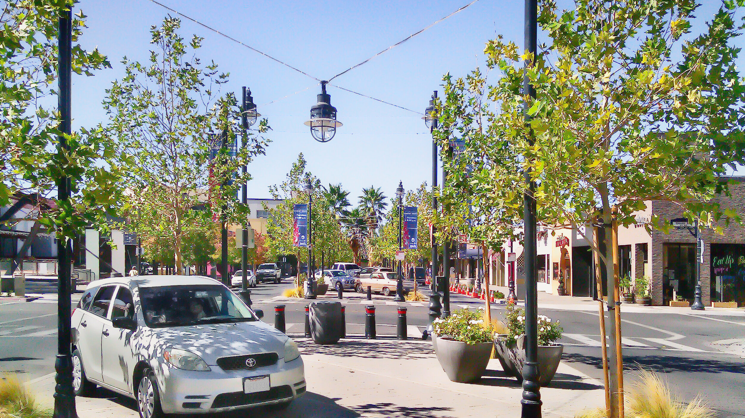 Now thriving and renamed The BLVD, Main Street in Lancaster, CA, was retrofitted from five travel lanes to two with parking/event space in the middle.