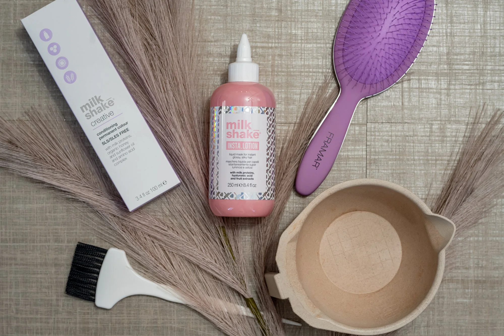  a box of milk shake hair conditioner, a bottle of milk shake insta lotion, Hair color services and products used at Moxxi Grey Salon in Colleyville, TX Leading Hair stylists and expert Hairdressers offering top-rated Hair styling services in DFW