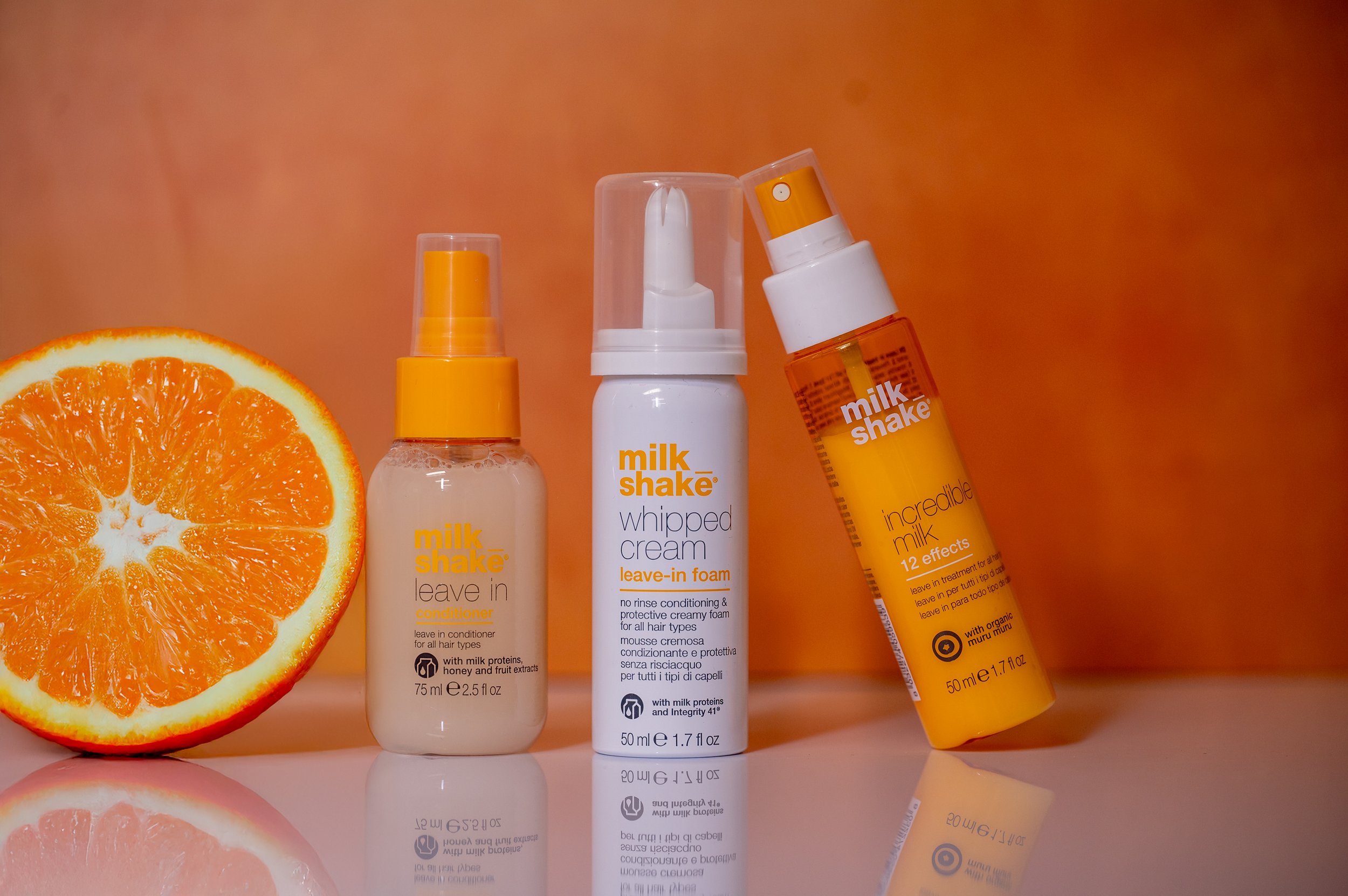 Three bottles of Milk Shake hair spray products Offered and sold at Moxxi Grey Salon in Colleyville, TX, Hair care products, Top rated Haircare products, the best Hair care products in Dallas, Fort Worth, Mid- Cities