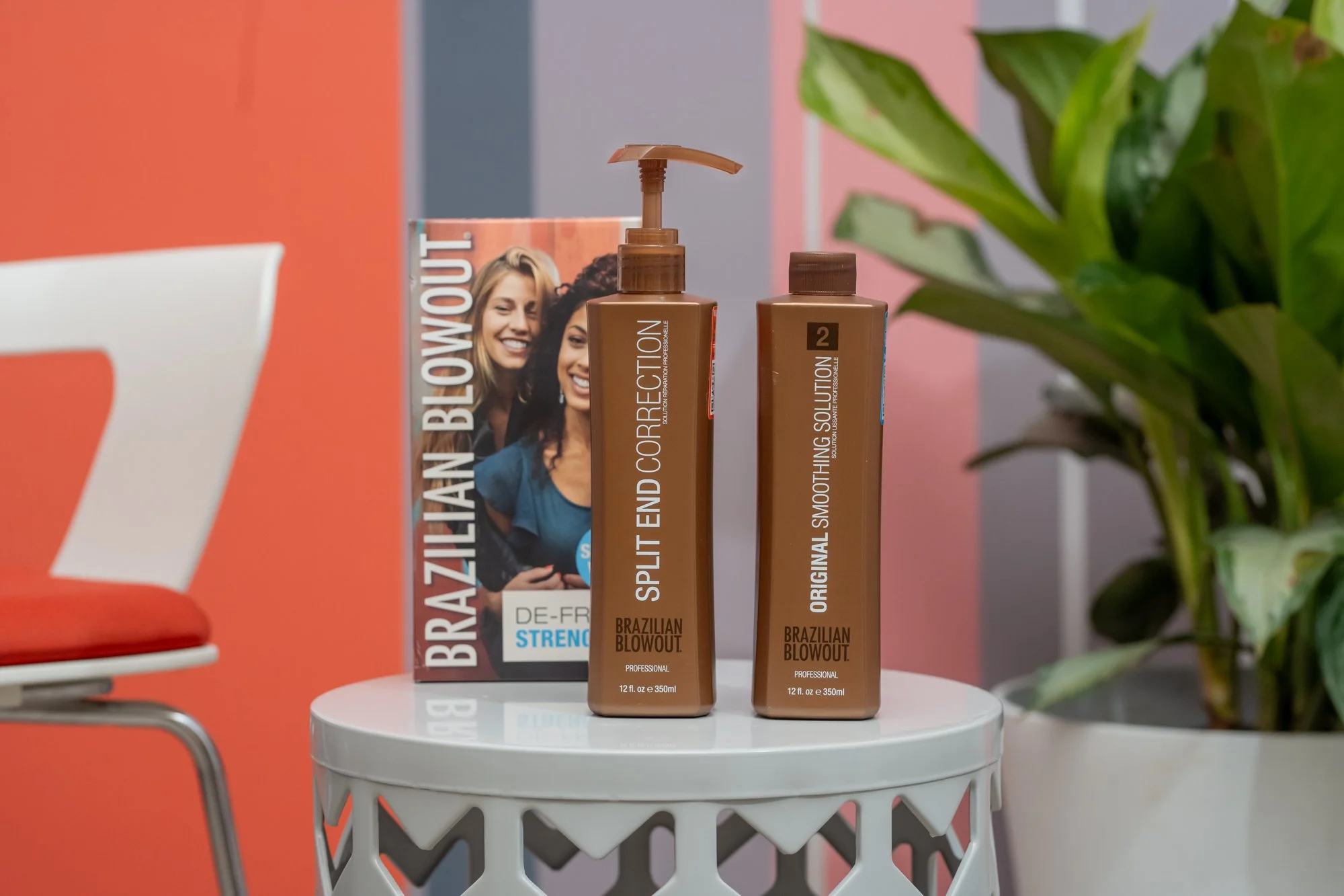 Two bottles of Brazilian Blowout hair smoothing products used at Moxxi Grey Salon in Colleyville, TX Leading Hair stylists and expert Hairdressers offering top-rated Hair styling services in DFW