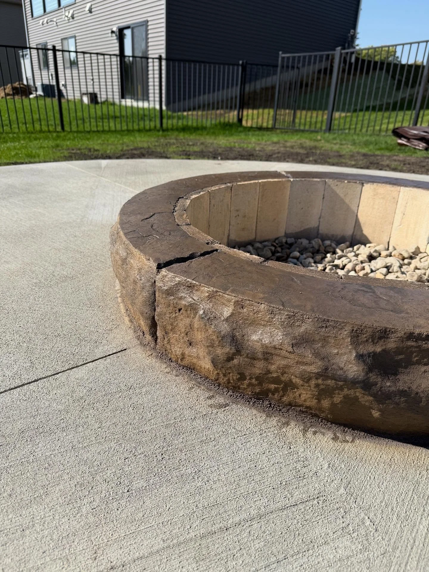 Nice built in fire pit with @decocrete_supply Mohawk color hardener