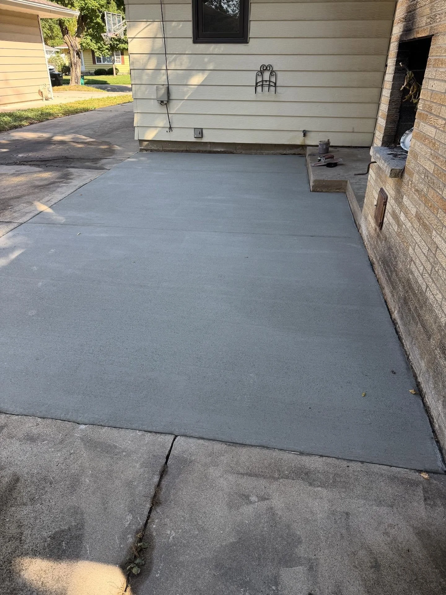 There was a goofy raised patio thing here with a couple of speed bump trip hazards for steps. So we got rid of one and put a standard sized step to the porch.