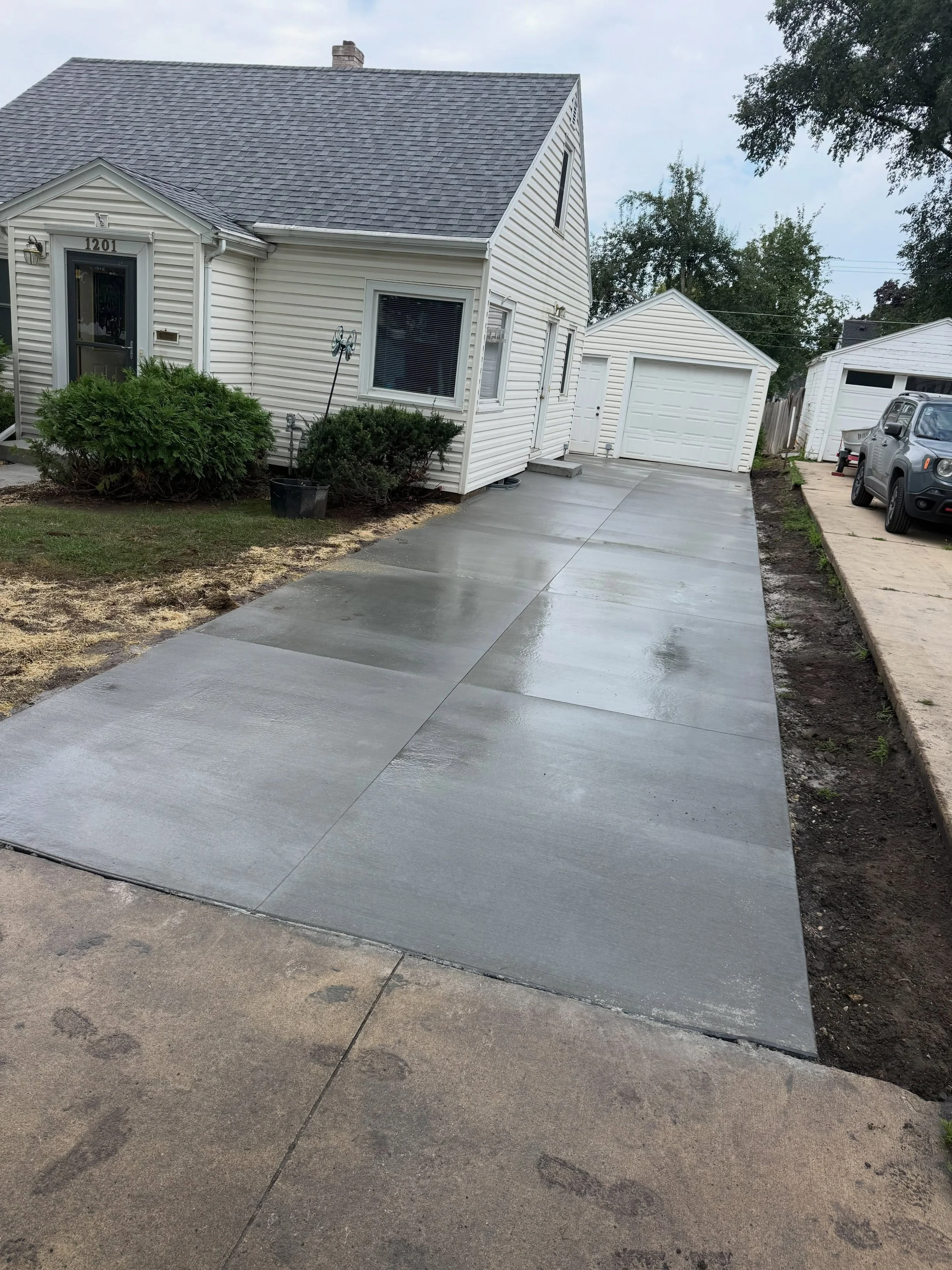 Widen the old driveway so you can actually open your car doors without stepping in the snow bank!