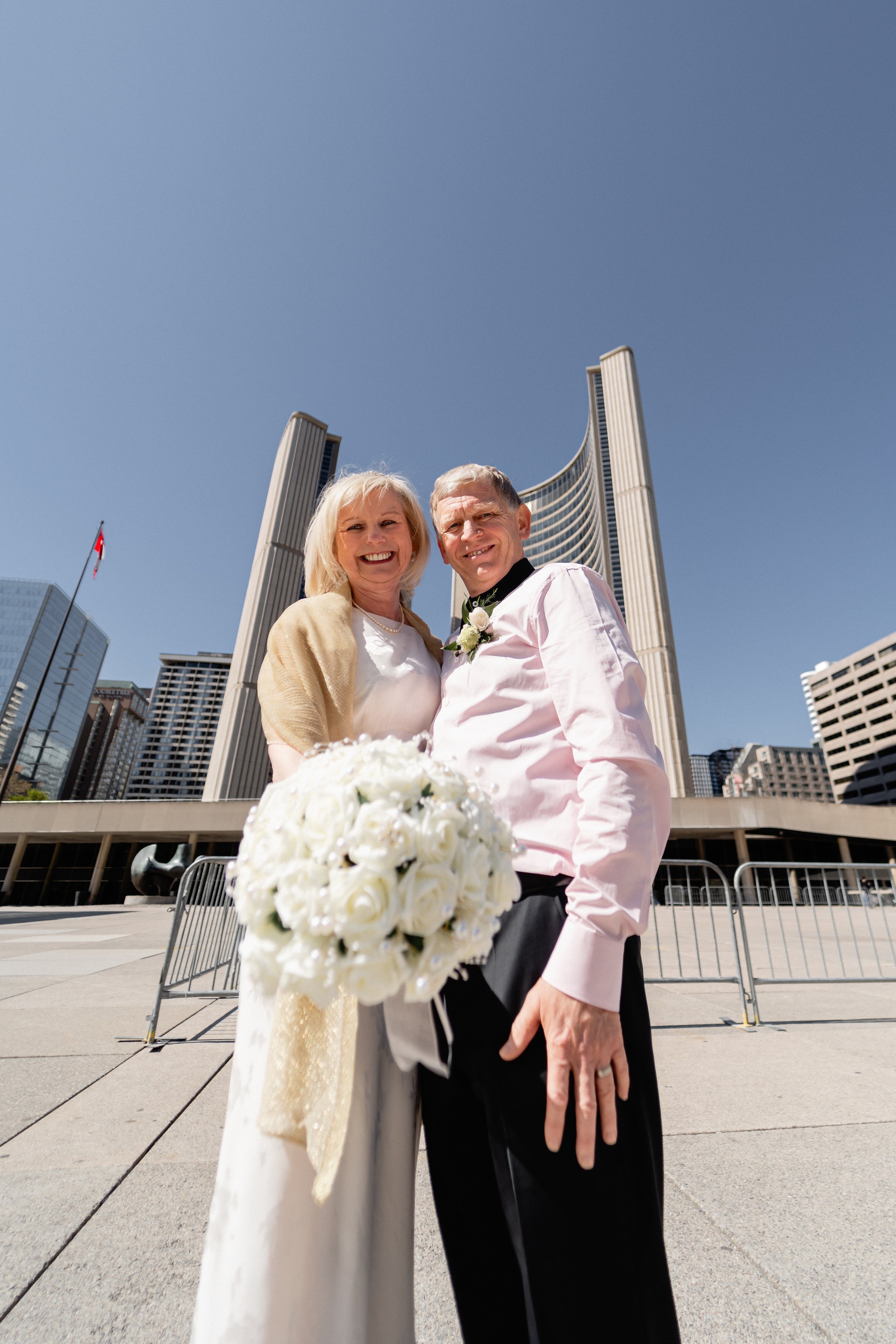 Civil wedding ceremony for older couple inside Toronto City Hall
