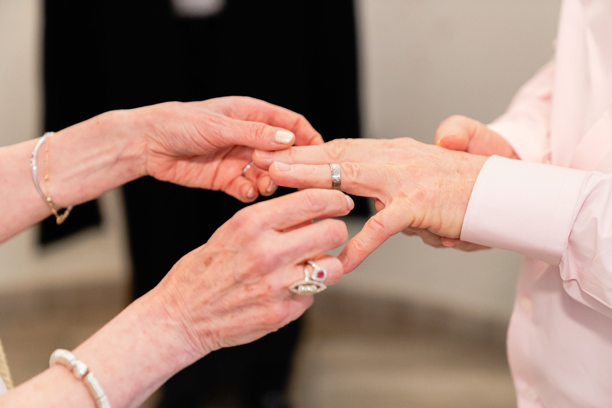 City Hall marriage officiant conducting wedding ceremony for mature couple