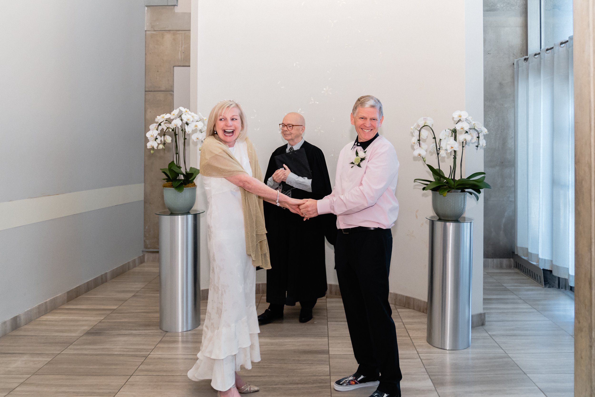 Judge officiating an intimate wedding in downtown Toronto civil court