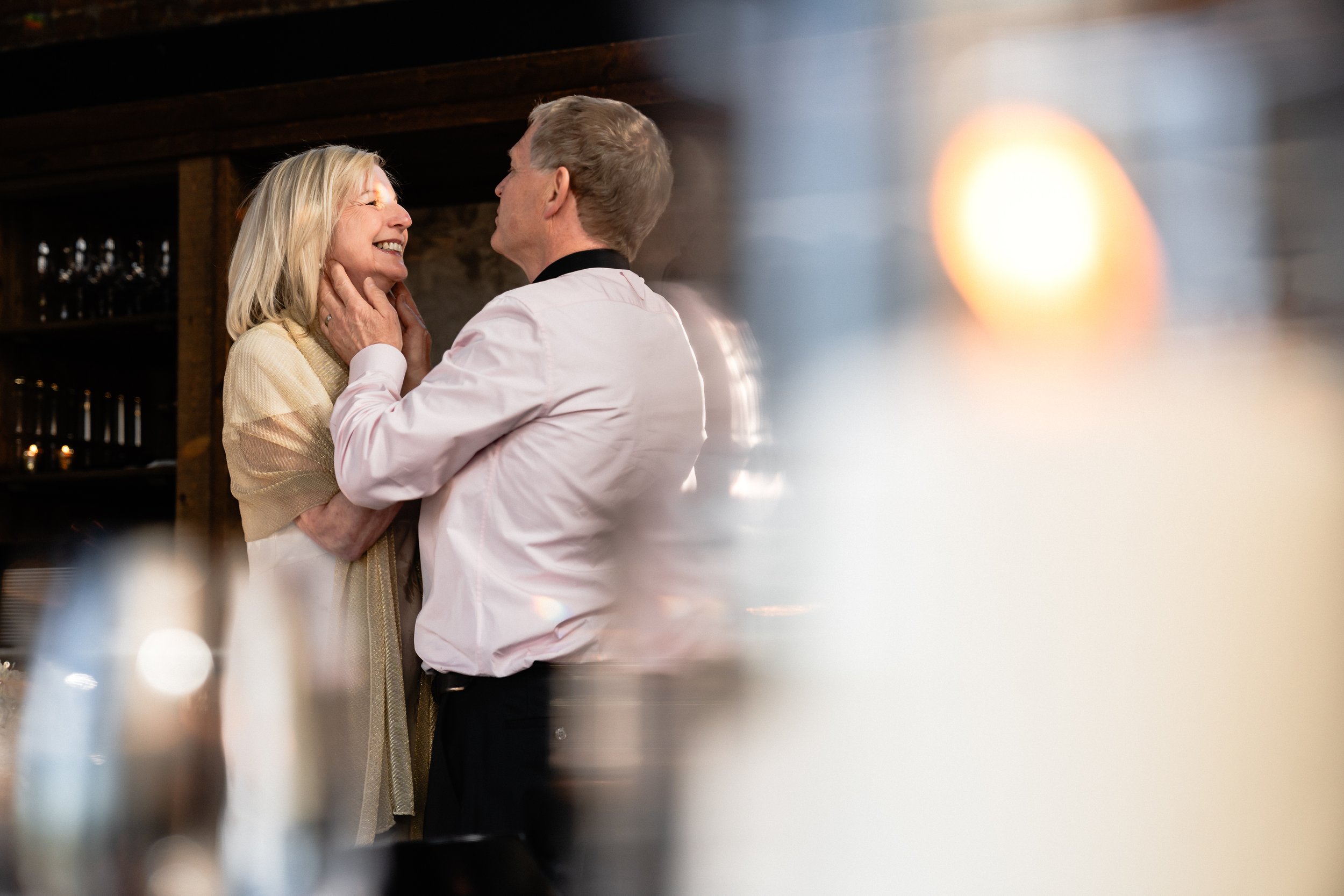 Intimate wedding portrait near floor-to-ceiling windows at Hilton Toronto