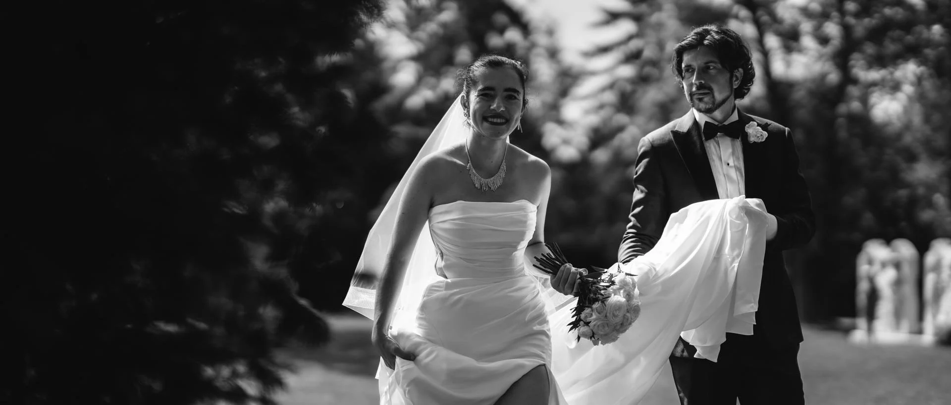 guild-park-wedding-toronto-couple-walking-tree-path-black-and-white.jpg