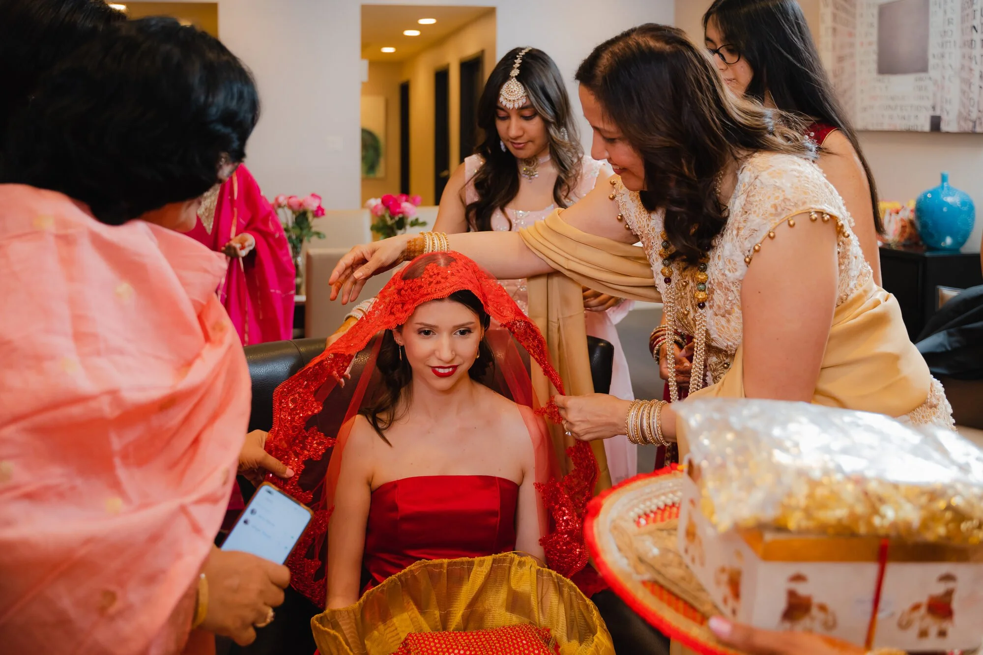 turkish-henna-night-toronto-red-veil-placed-on-bride.jpg