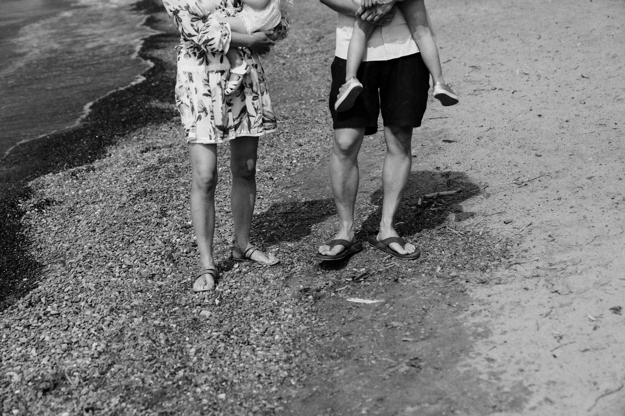 scarborough-bluffs-beach-family-session-feet-in-water-black-and-white.jpg