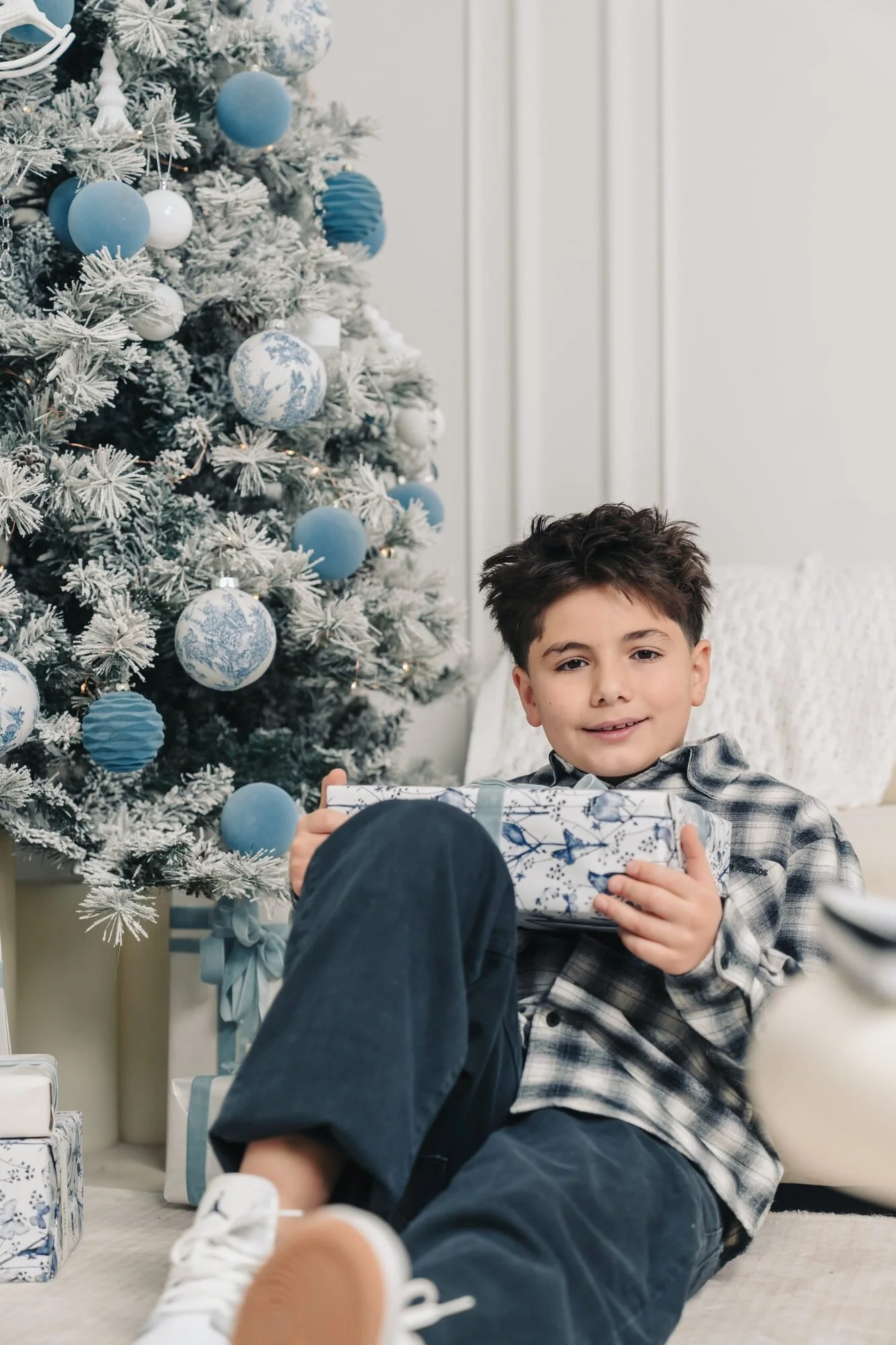 boy-by-christmas-tree-icon-studio-space-toronto-holiday-mini-session.jpg
