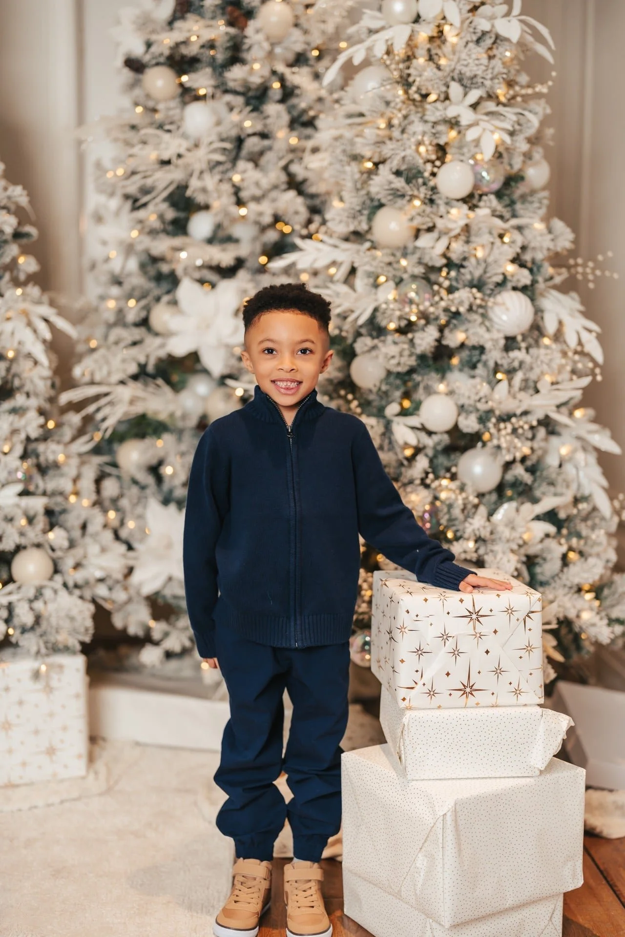 ruby-manor-christmas-mini-session-boy-with-gifts.jpg