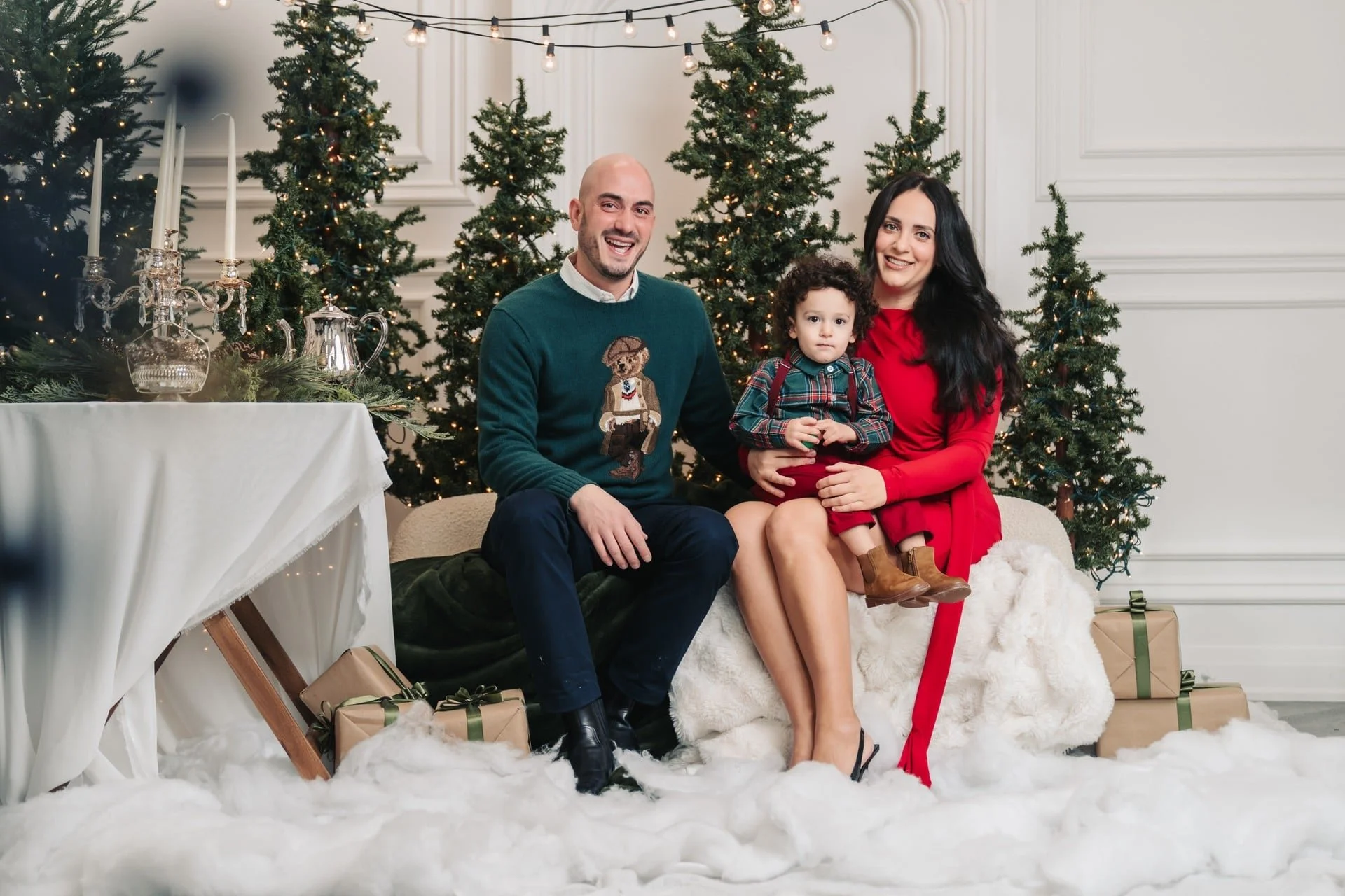 Family in red and green at a classic Christmas photoshoot, Toronto studio