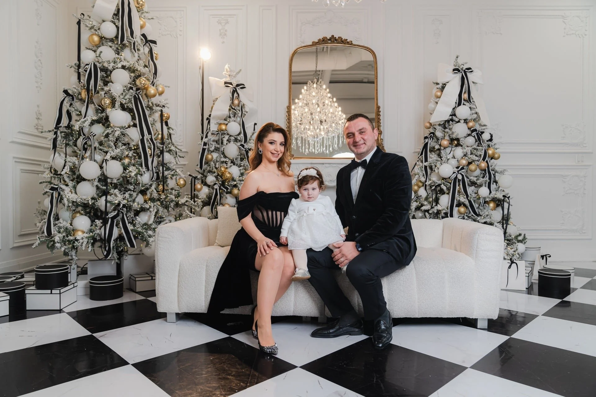 Elegant family Christmas photoshoot on a checkerboard floor, Toronto studio