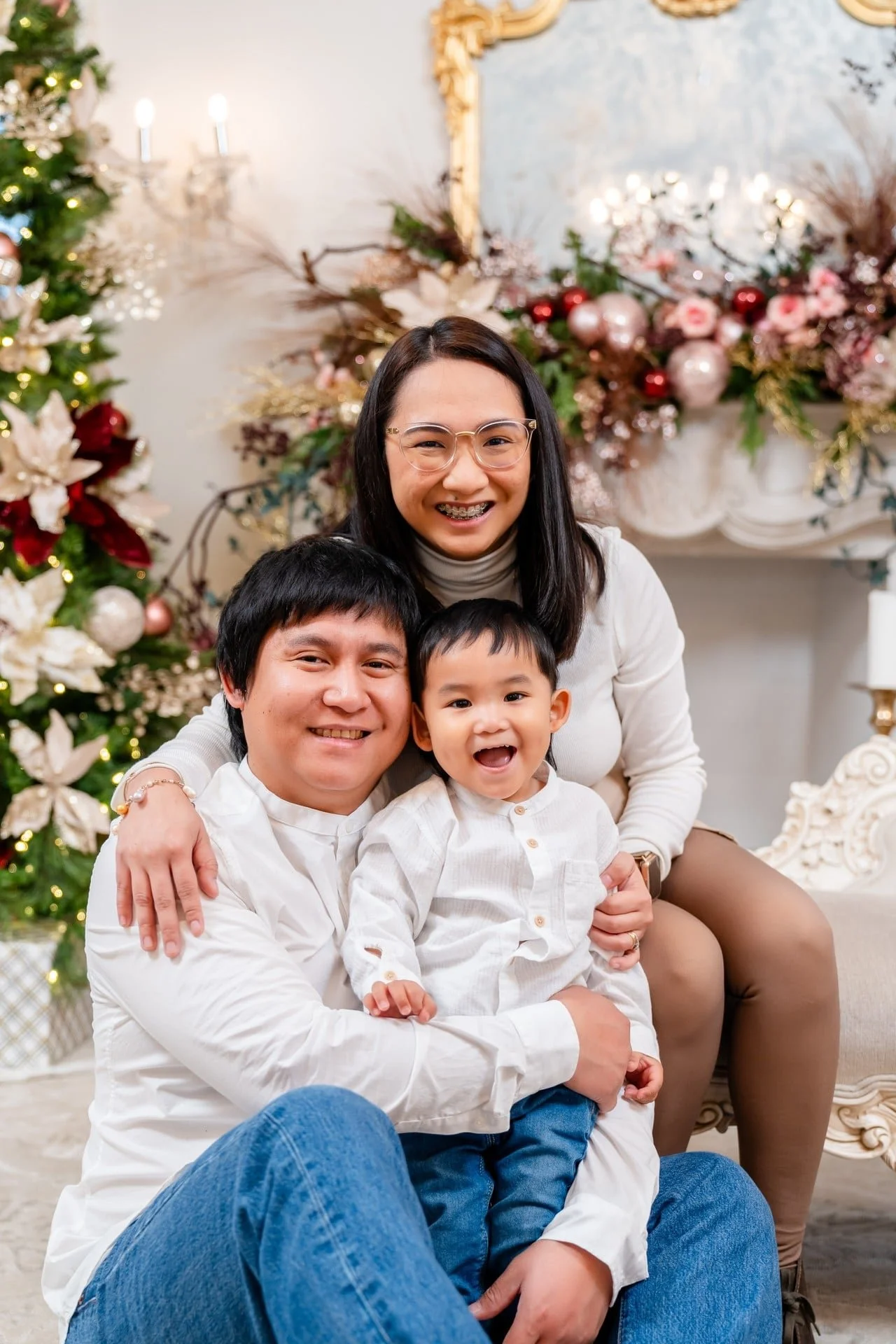 	Family with their baby at a first Christmas mini session in Toronto