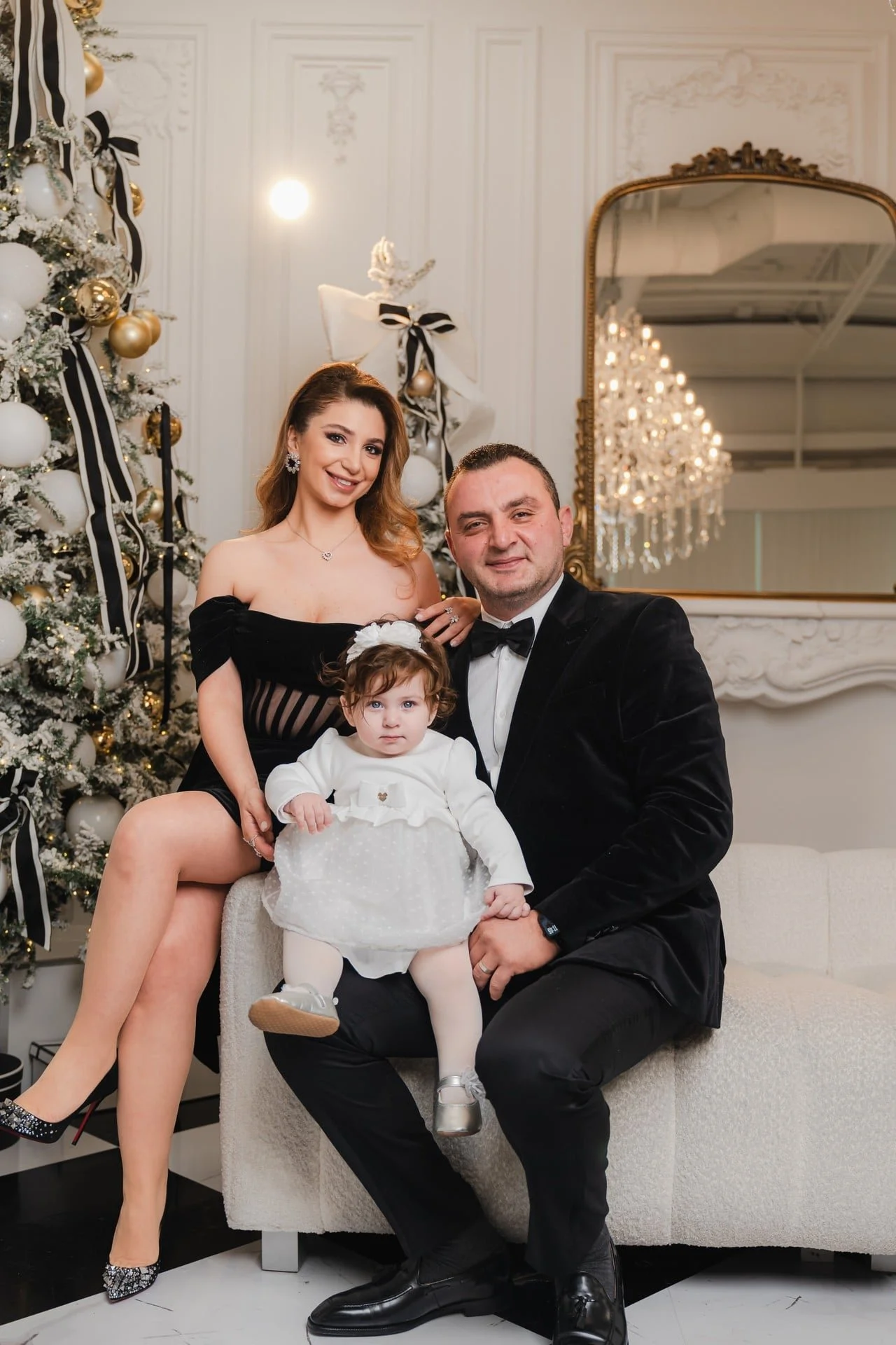 Family with their baby at a first Christmas mini session in Toronto