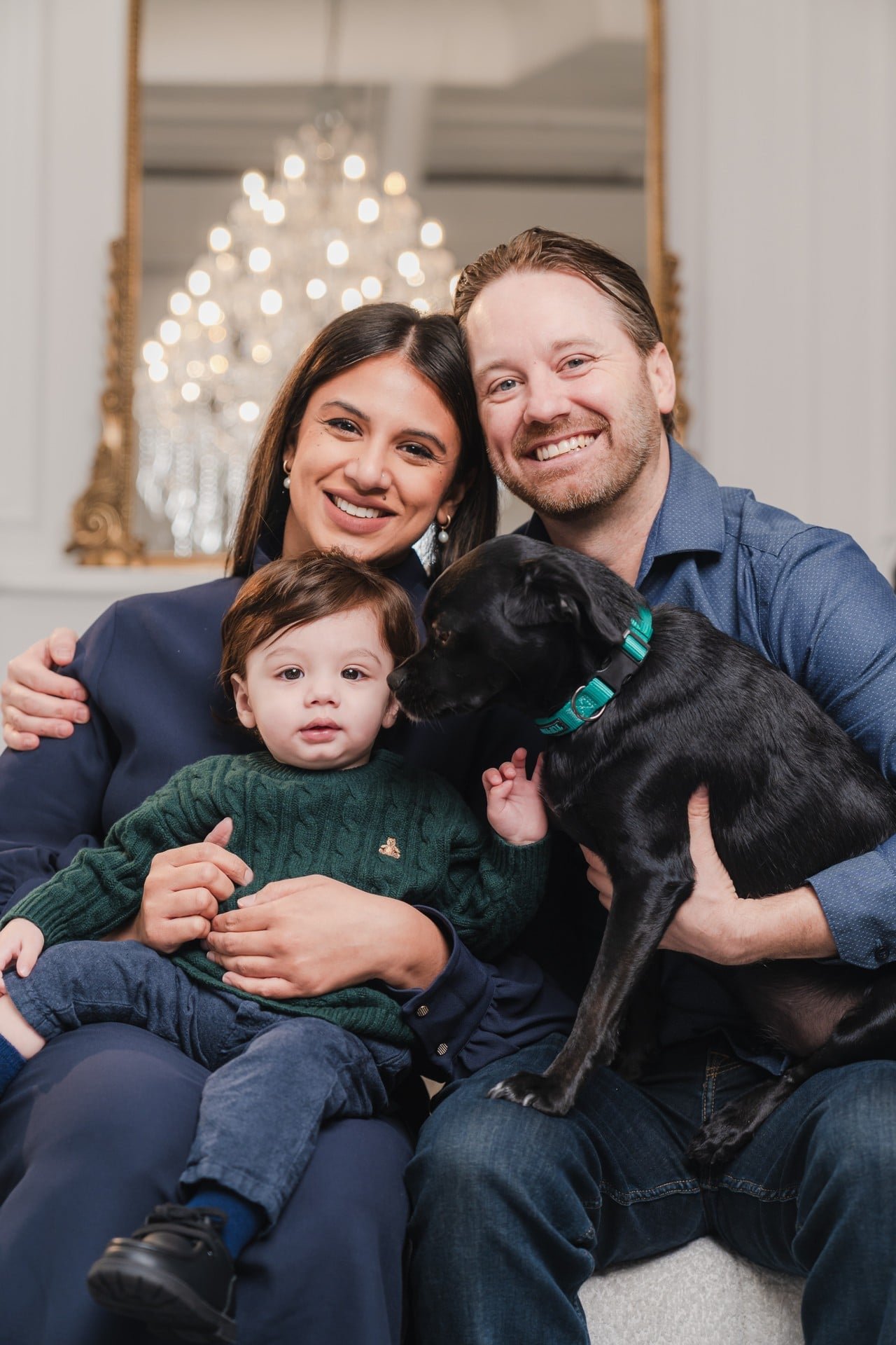 Family, baby and dog at a first Christmas mini session in Toronto