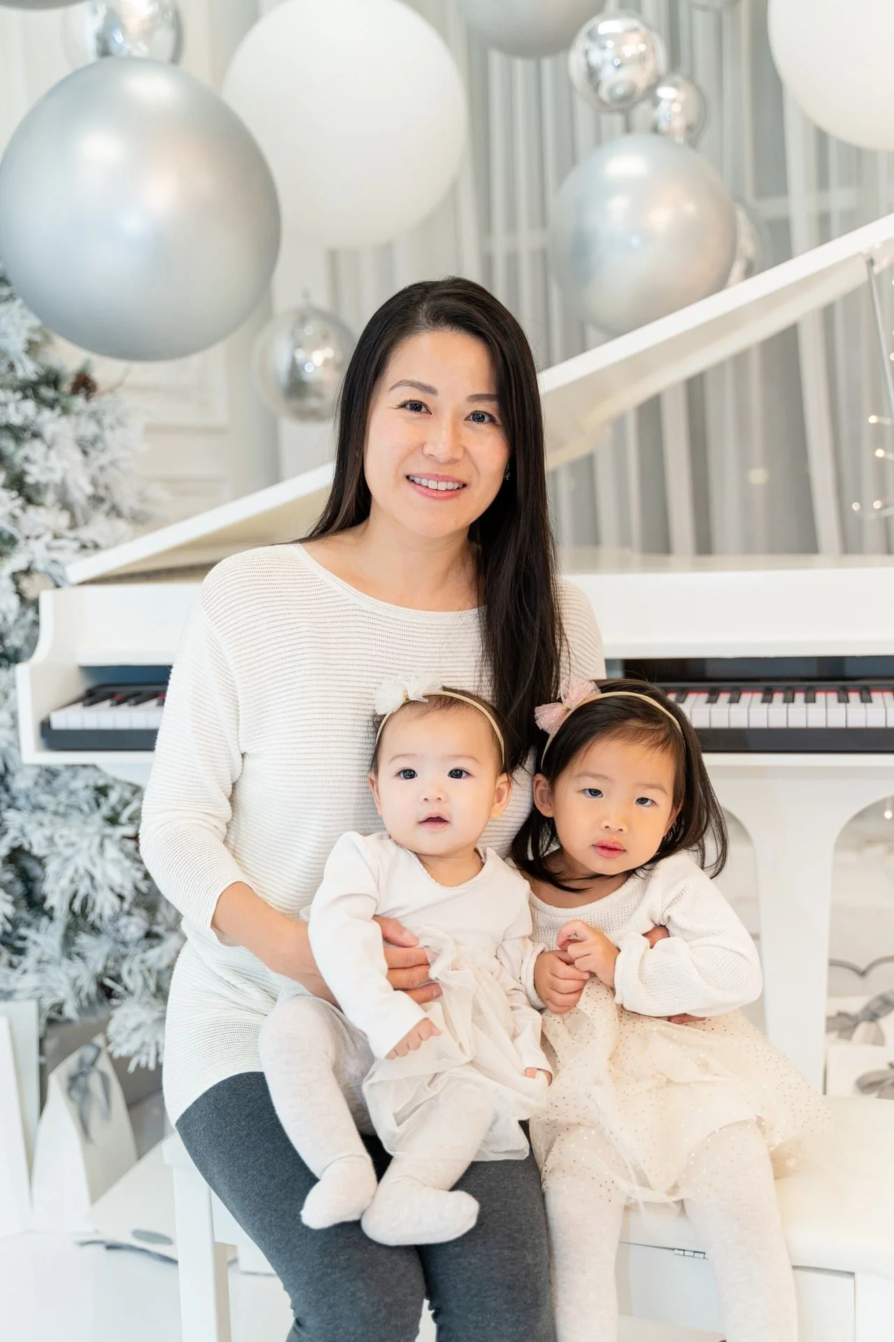 Mother with her babies at a first Christmas mini session in Toronto
