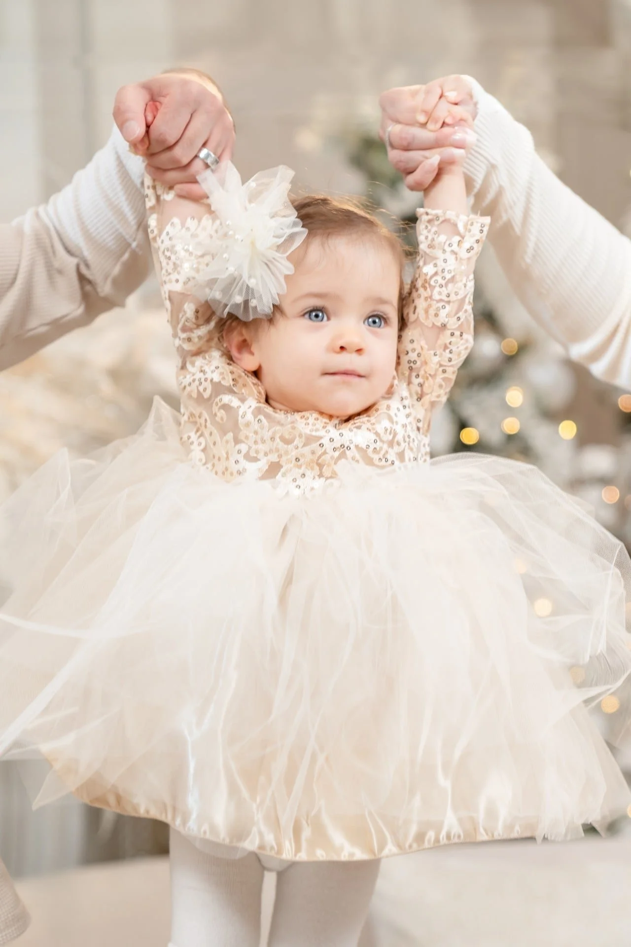Baby girl in a cream tutu at her first Christmas mini session, Toronto
