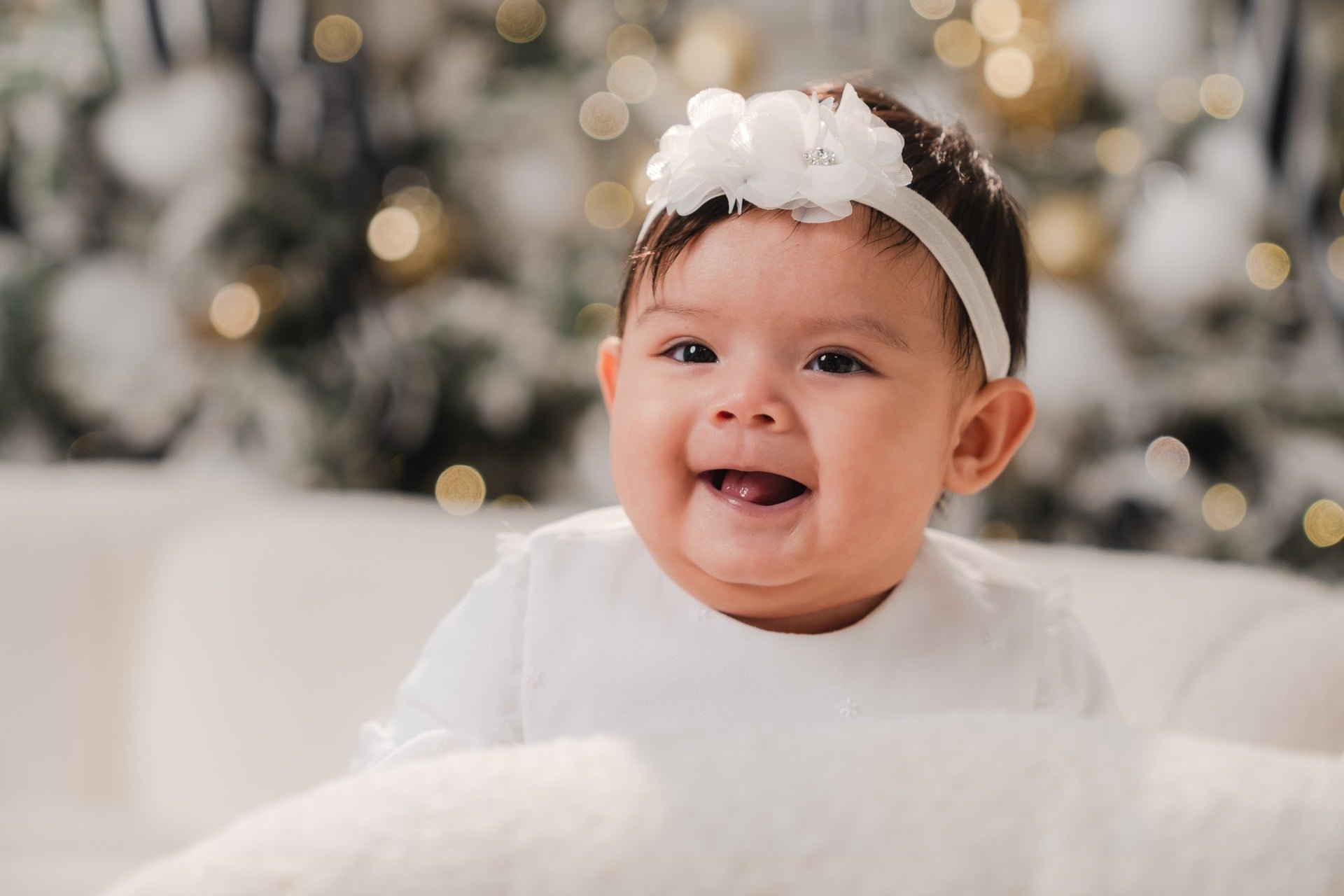 Smiling baby girl at her first Christmas mini session in Toronto