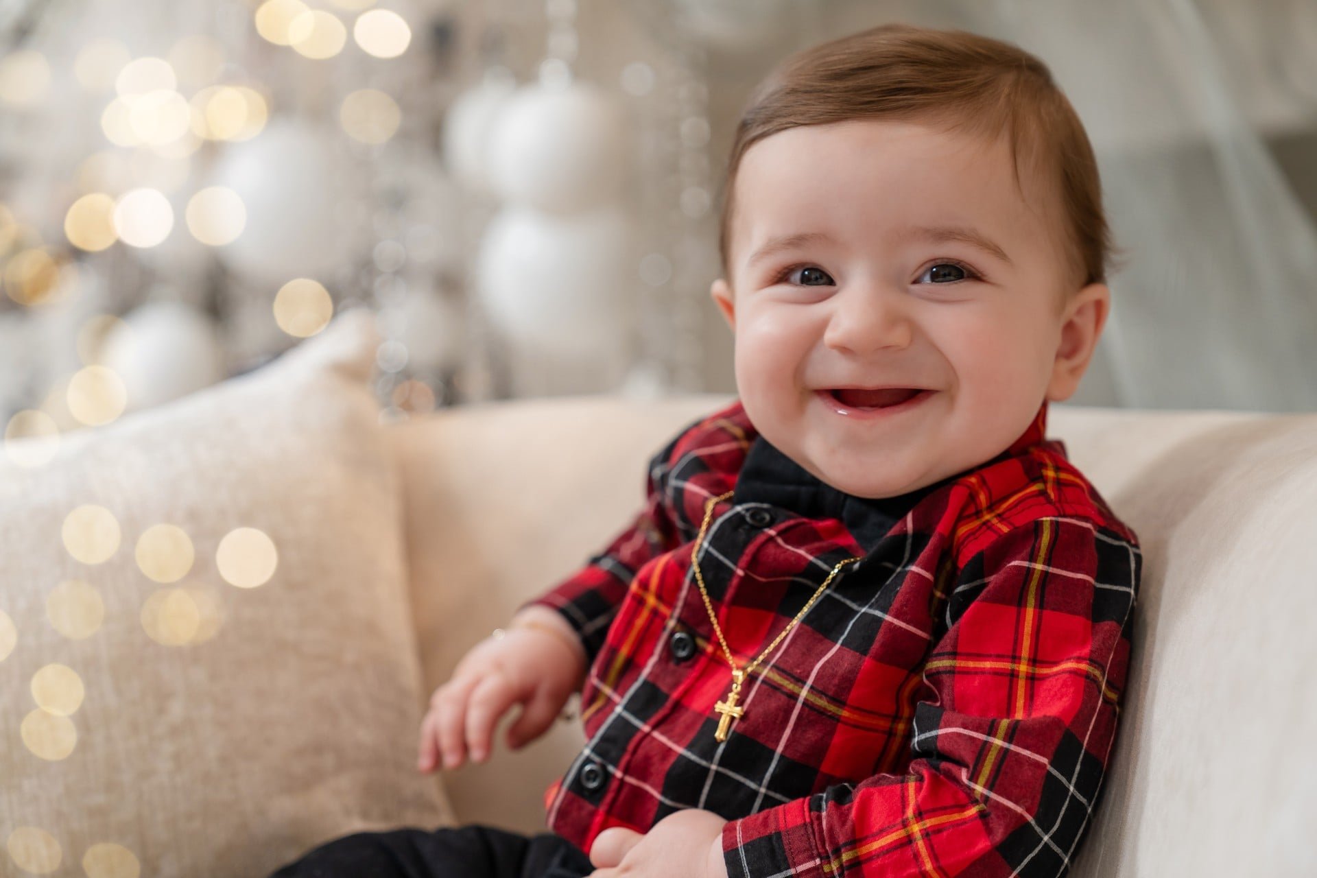 Baby in red plaid at a first Christmas mini session in Toronto
