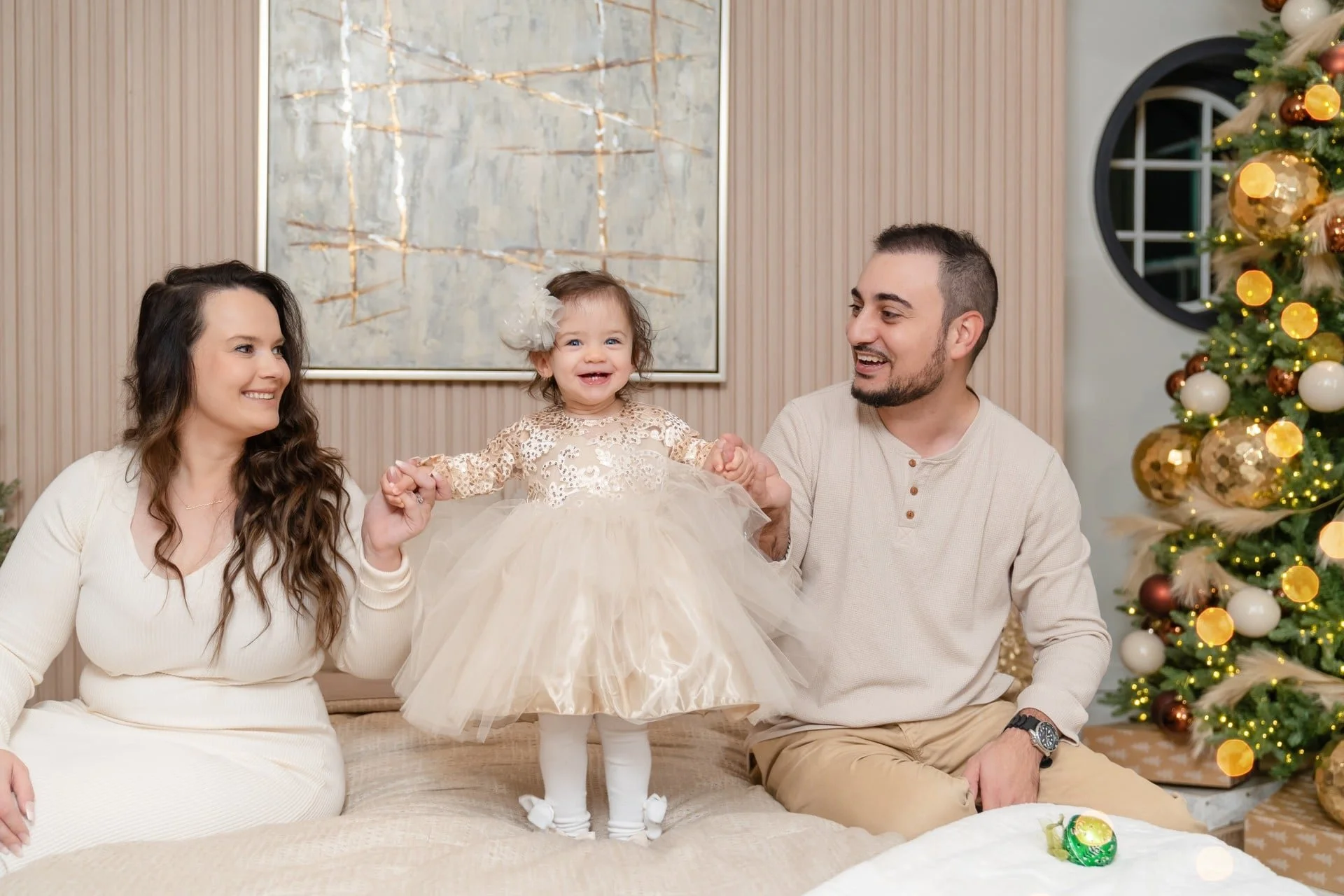 Family with their baby girl at a first Christmas session in Toronto