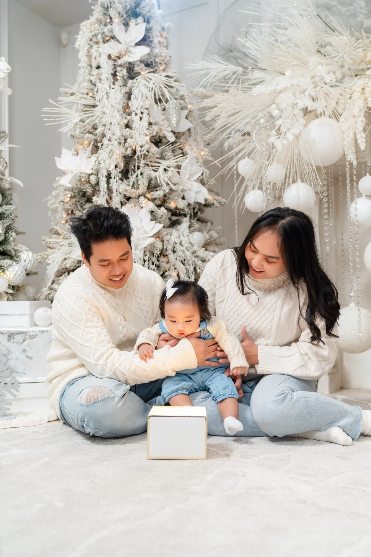 Family with their baby at a first Christmas mini session in Toronto