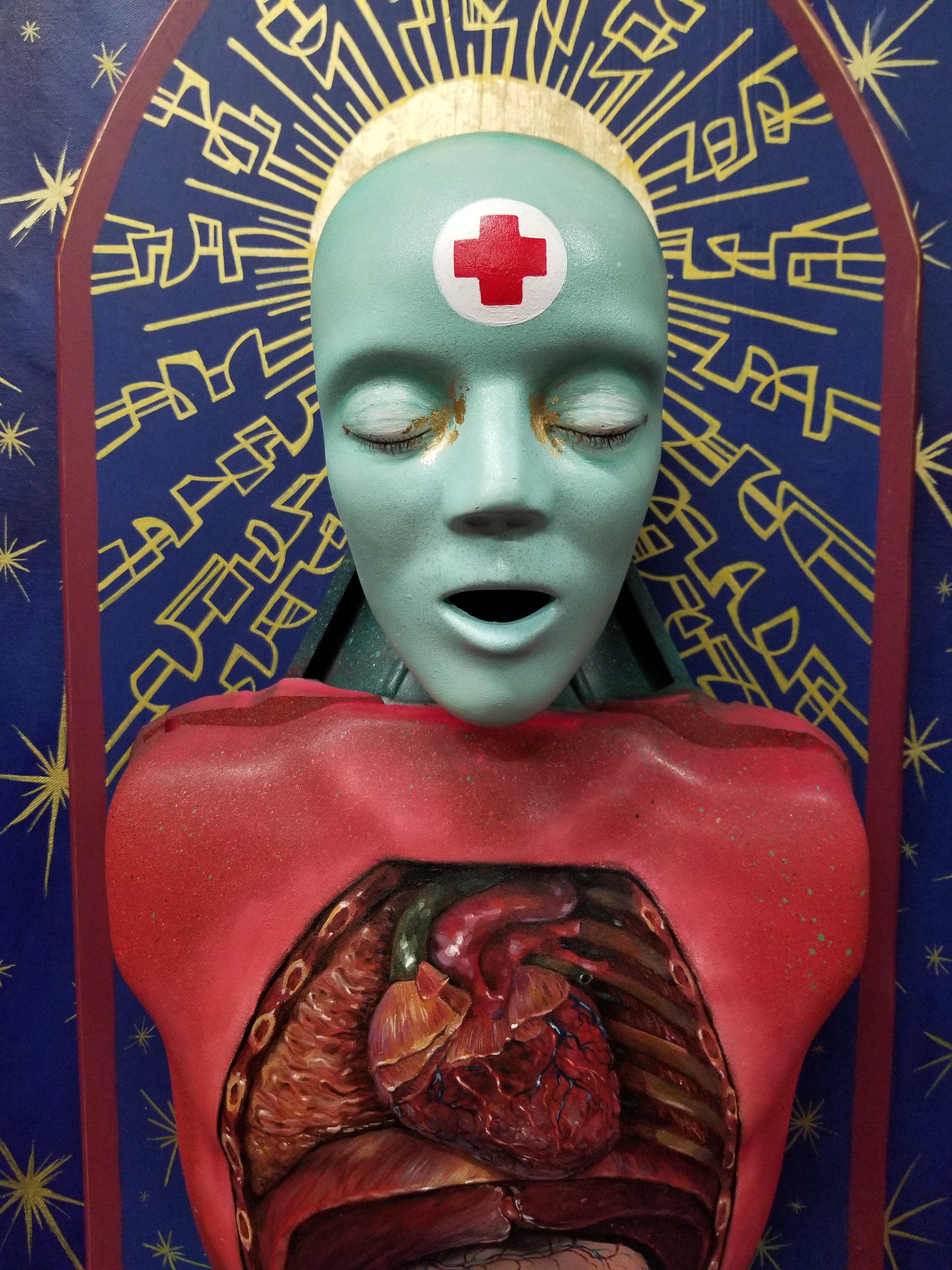 “Saint Teresa”
Cpr mannequin head, spray paint, acrylic, wood, gold leaf, canvas
31” x 16”
$800
(Details)
Email oddmoddworks@gmail.com for Shipping Inquiries
