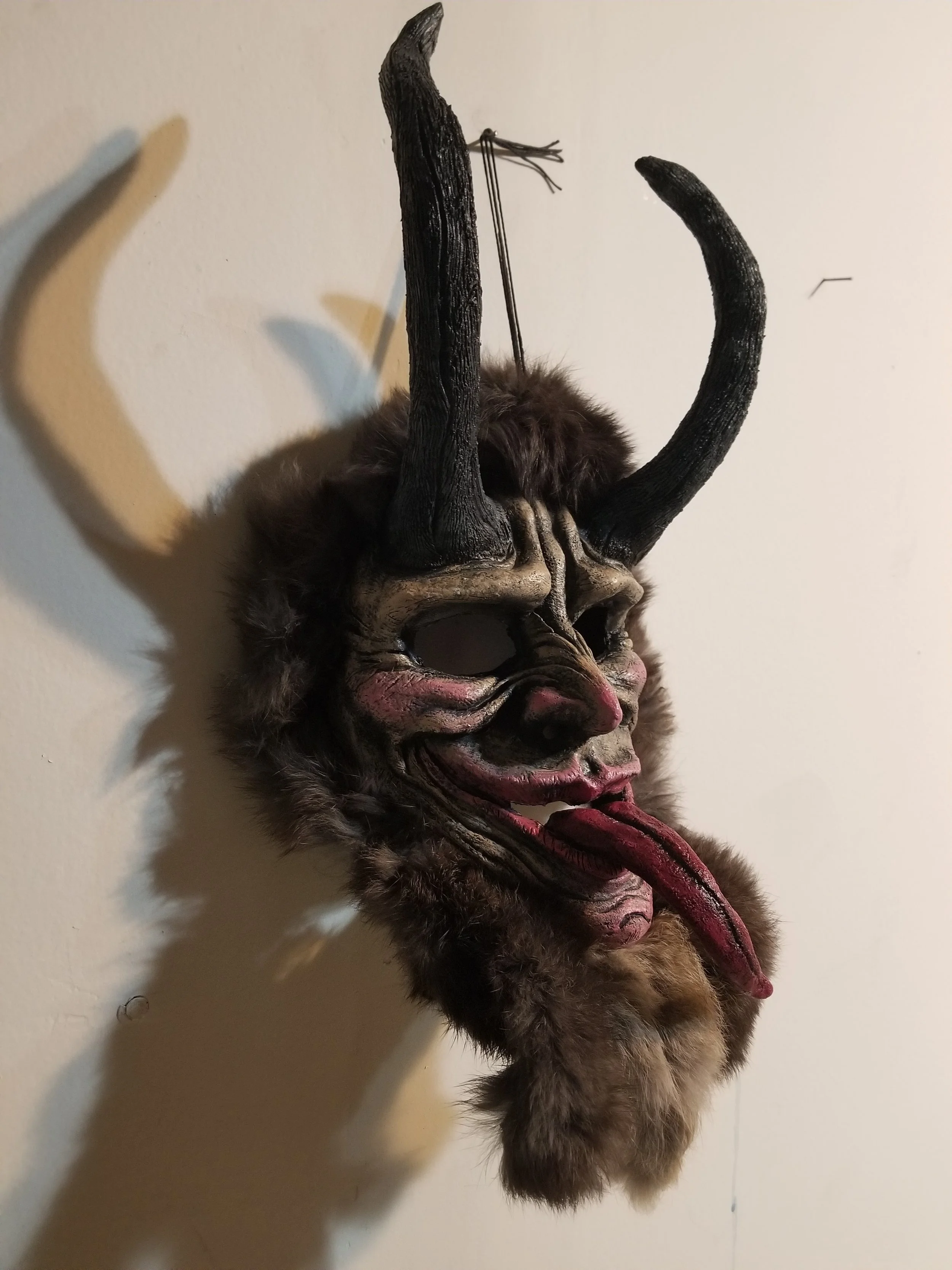 Krampus Mask
Stone clay, acrylic, rabbit pelt
18” x 9”
$150
(Details)
Email oddmoddworks@gmail.com for Shipping Inquiries

