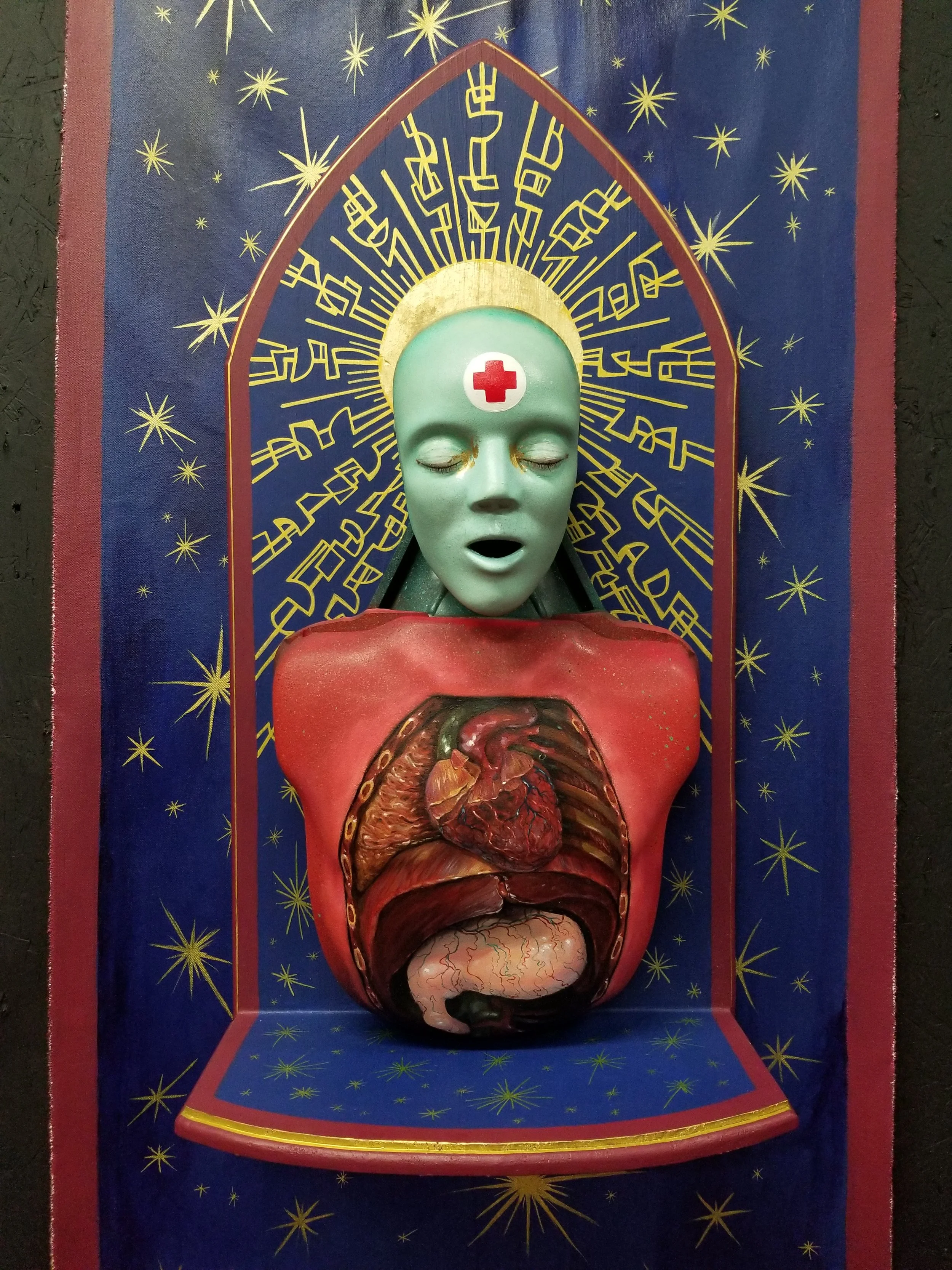 “Saint Teresa”
Cpr mannequin head, spray paint, acrylic, wood, gold leaf, canvas
31” x 16”
$800
Email oddmoddworks@gmail.com for Shipping Inquiries
