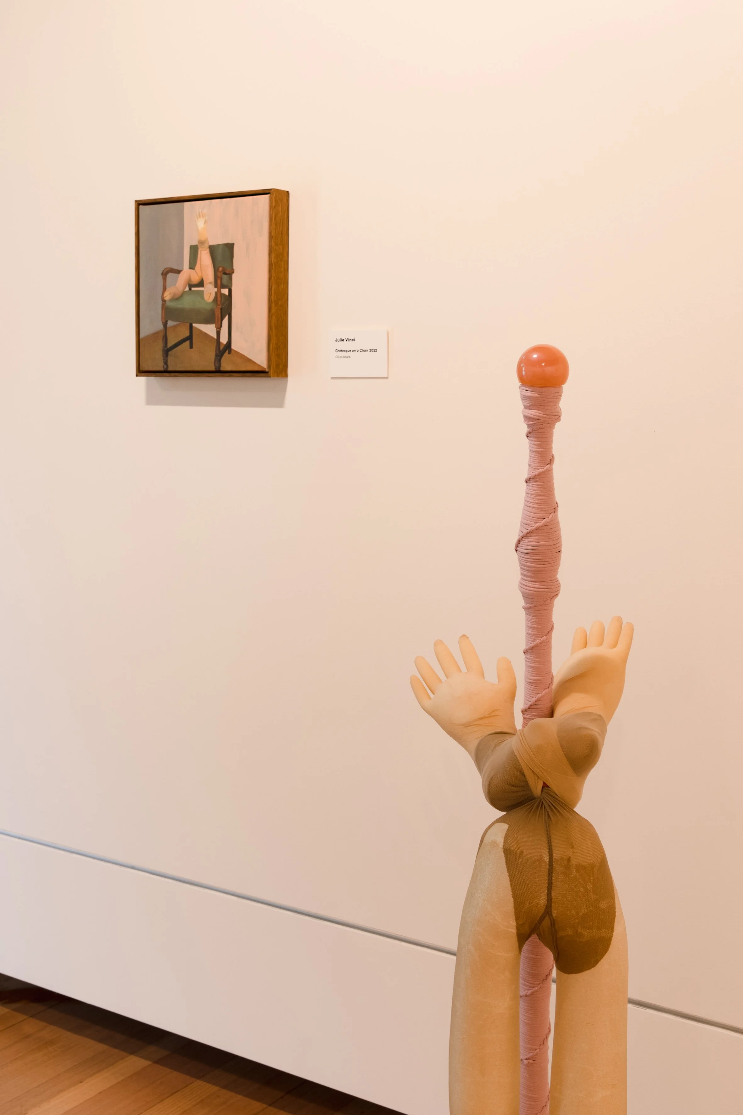 A Little to The Left, 2022	
Found furniture, enamel paint, linoleum, gold leaf, resin, nylon rope, nylon pantyhose, foam, found glove, steel nails	
60 x 140 x 35cm